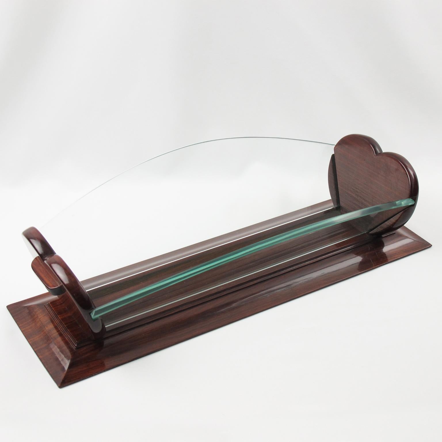 This stunning Art Deco centerpiece, decorative bowl, or serving fruit or bread basket exudes a lot of presence and elegance. The rare piece was crafted in France circa 1930. The varnished wood base has a stunning heart-shaped carved design on the