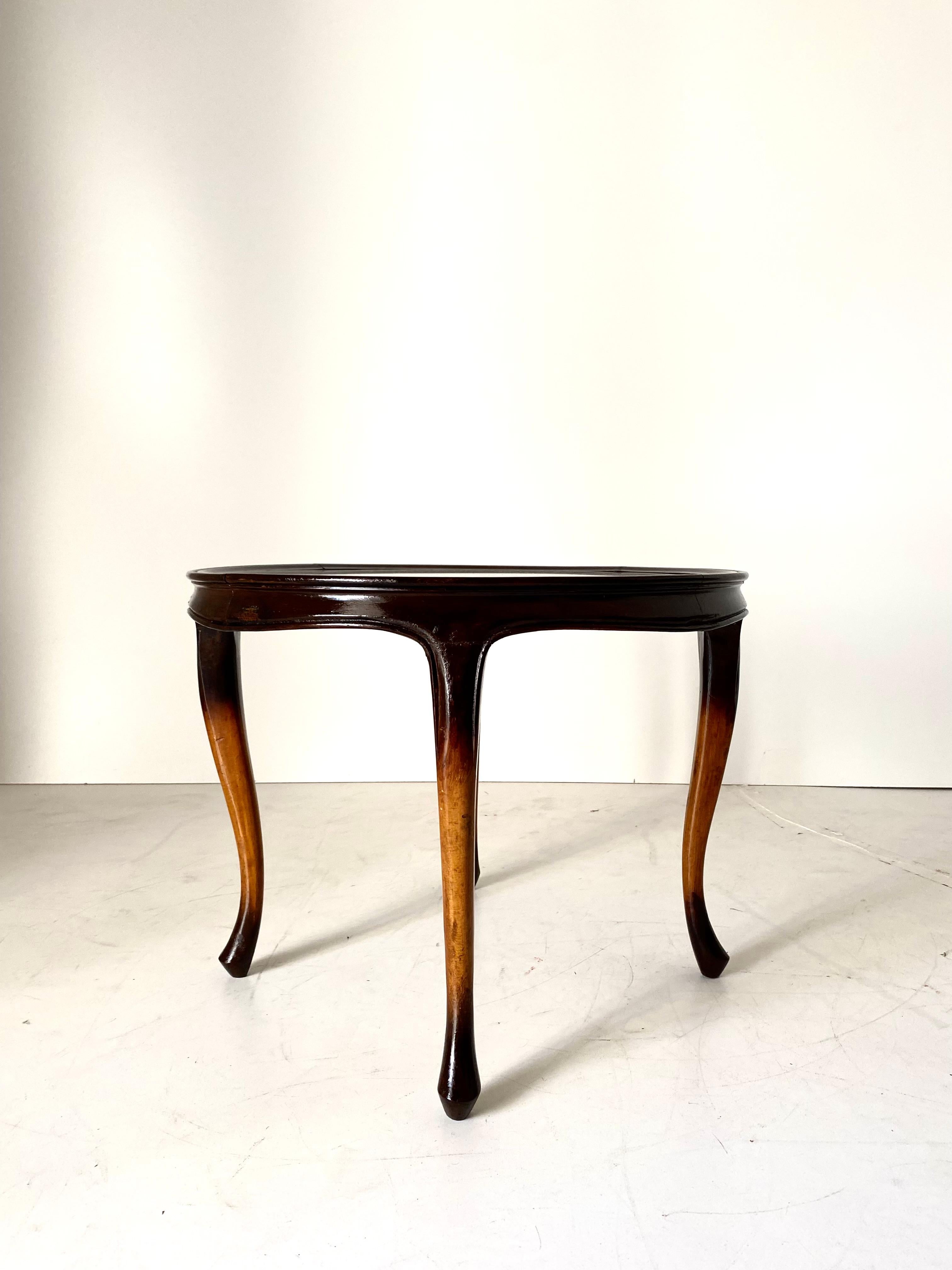 Art Deco wood coffee Table, France, early 1940s.
An elegant 1940s Art Deco side table with glass top and solid wood curved wood structure. Wood has been restored and polished,
In very good conditions with only few signs of time.