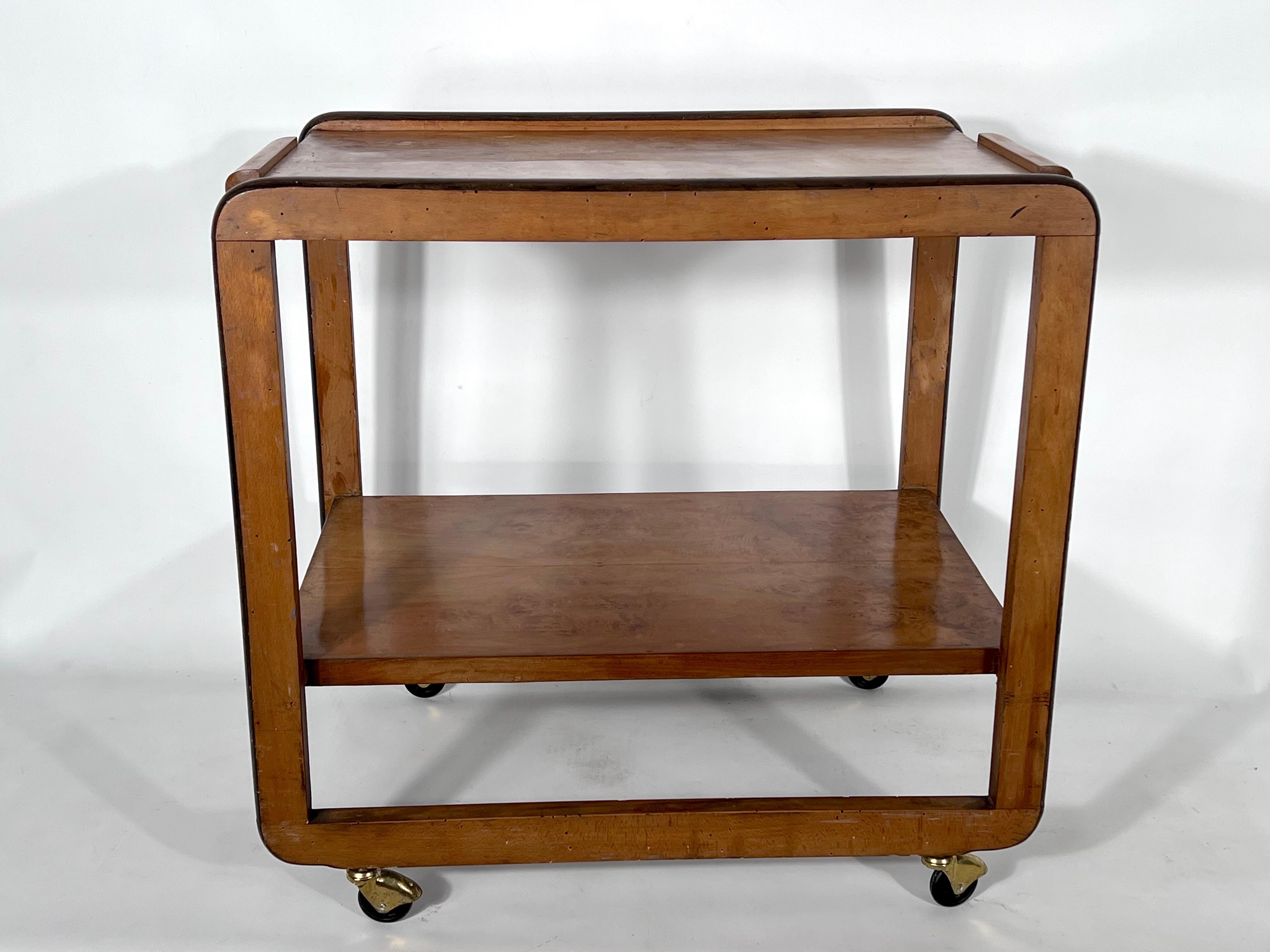 Original vintage condition with normal trace of age and use for this serving table or bar cart made from wood and brass wheels. Produced in Italy during the 30s.