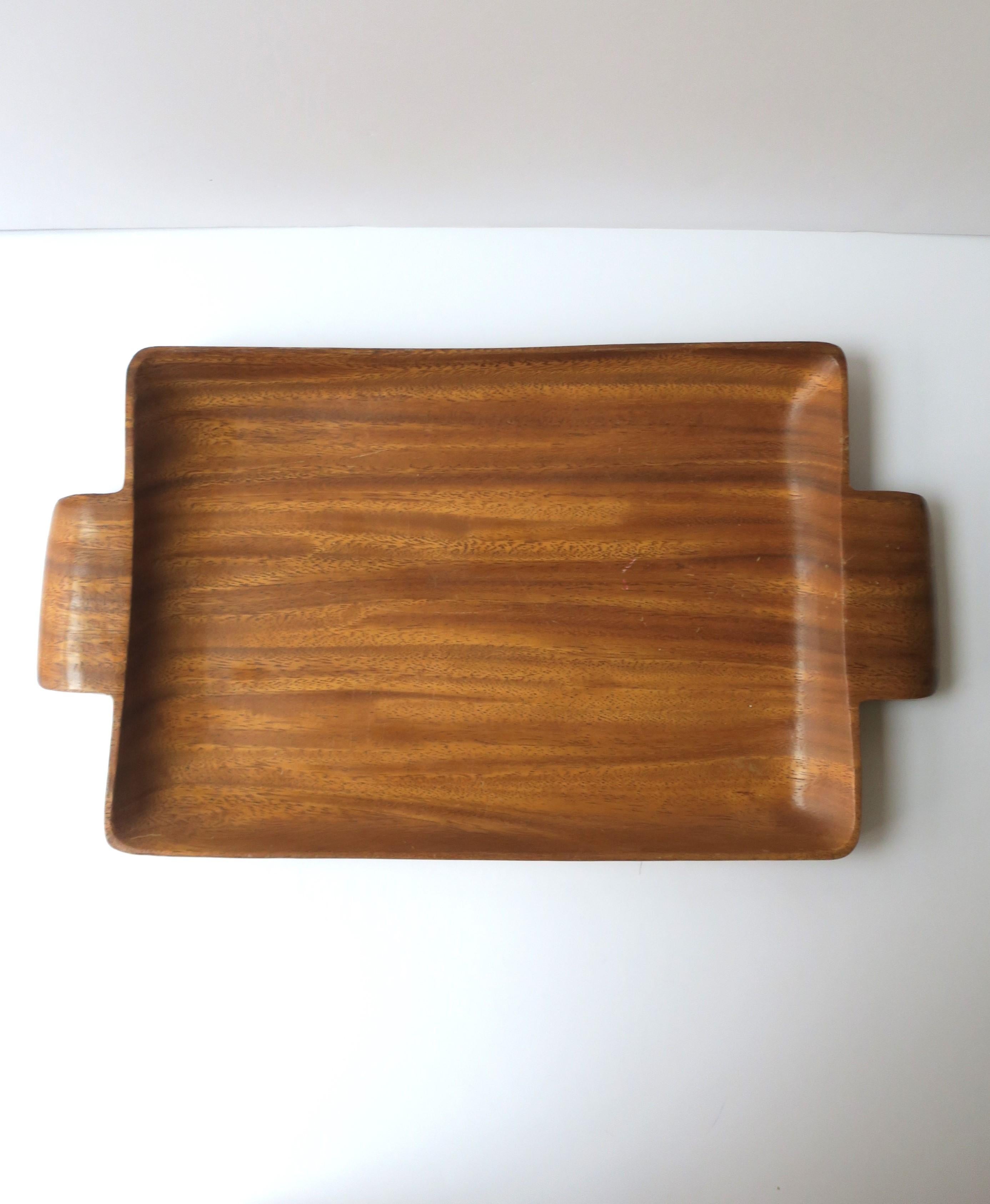 A light-weight Art Deco wood serving tray with handles, circa mid-20th century. Dimensions: 9.82