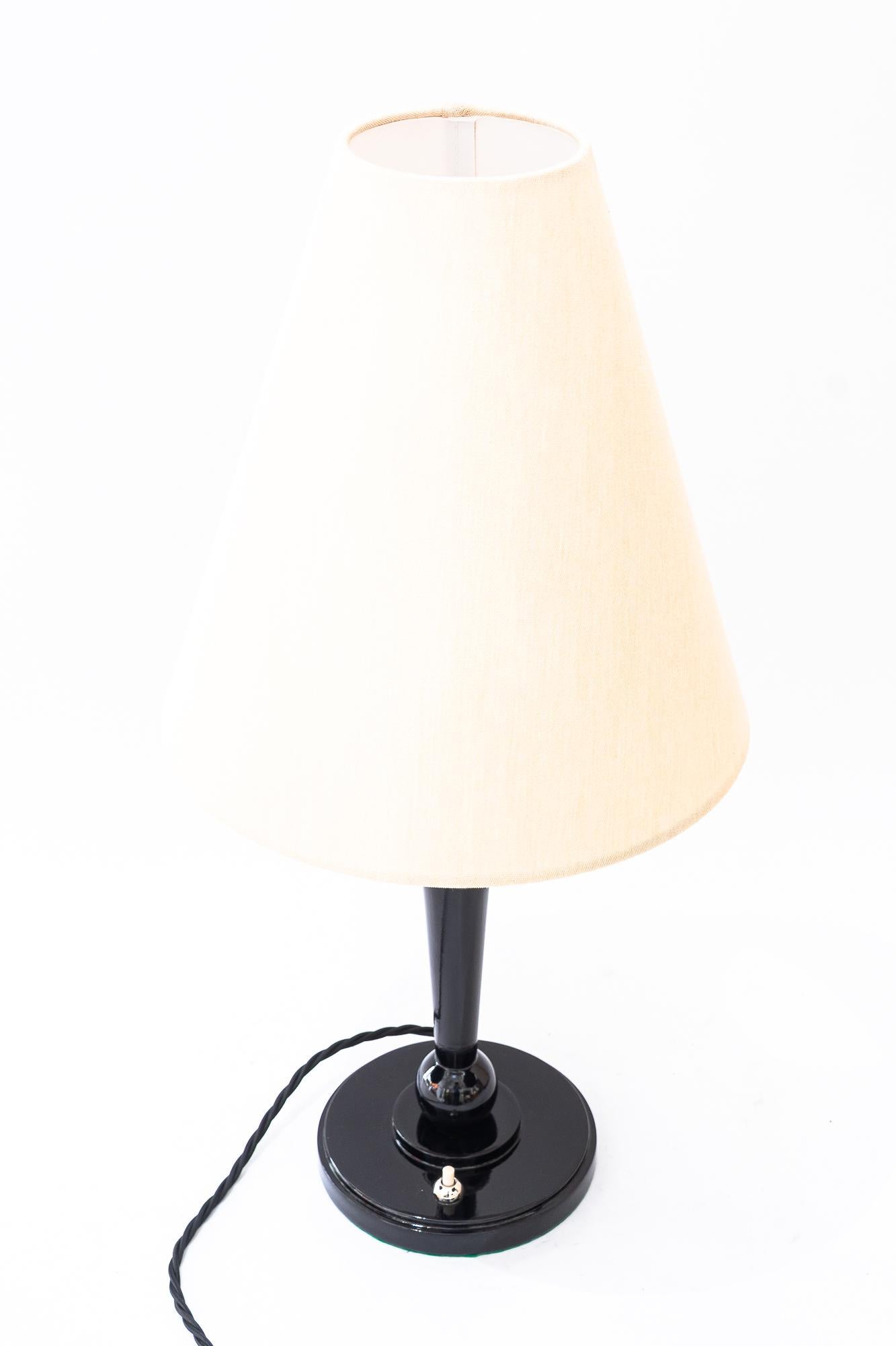 Art Deco Wood table lamp and fabric shade vienna around 1920s
Wood polished
Brass is nickel - plated
The big fabric shade is replaced ( new )