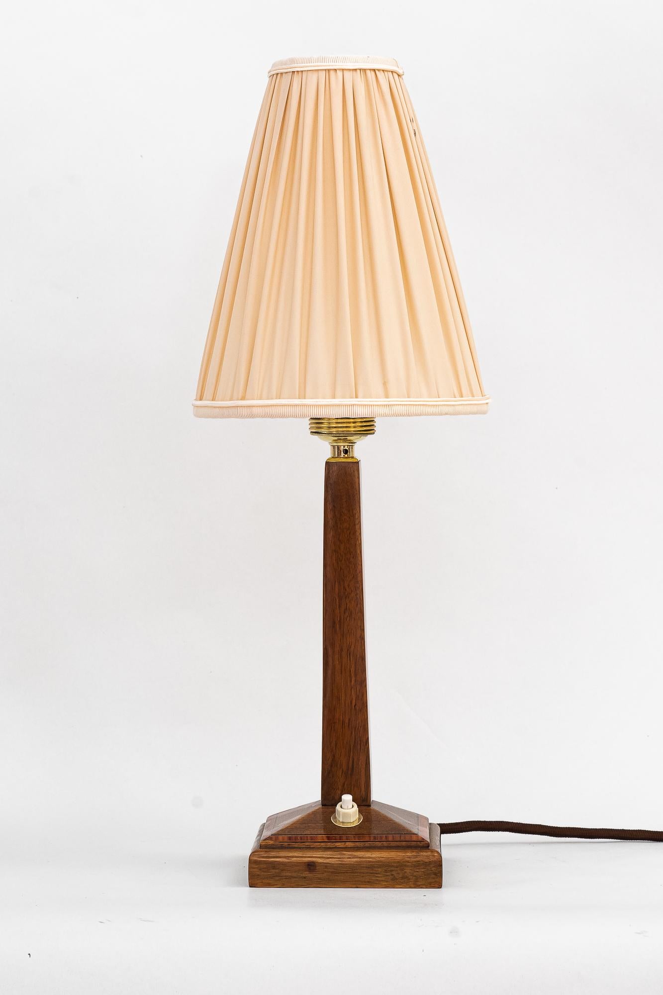 Art Deco wood table lamp with fabric shade vienna around 1920s
The shade is replaced ( new )
Wood polished.
 
