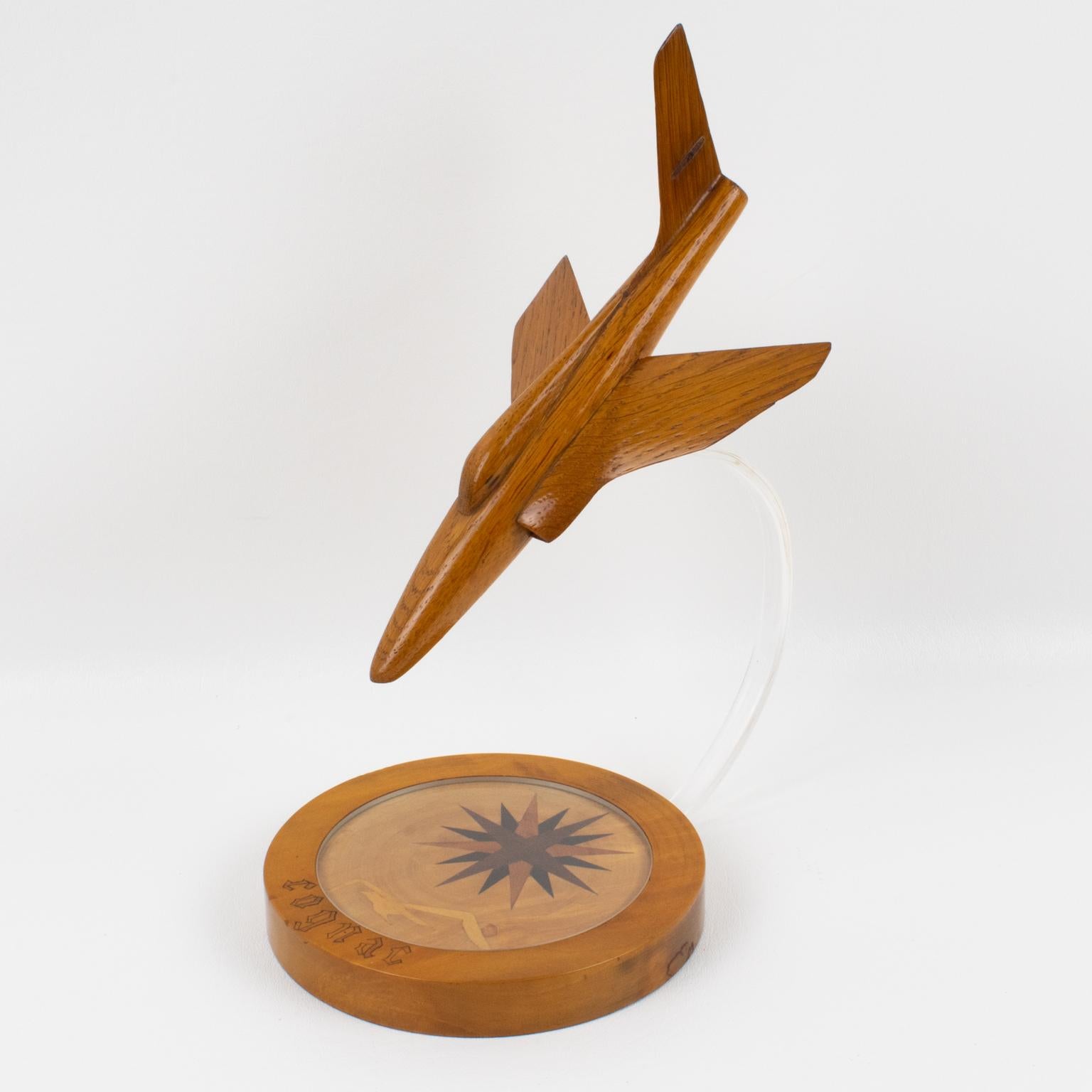 A stunning hand-made oak sculpture aviation model featuring a jet airplane. Rounded stepped oak wood base with compass marquetry, a flying albatross bird, and marked 