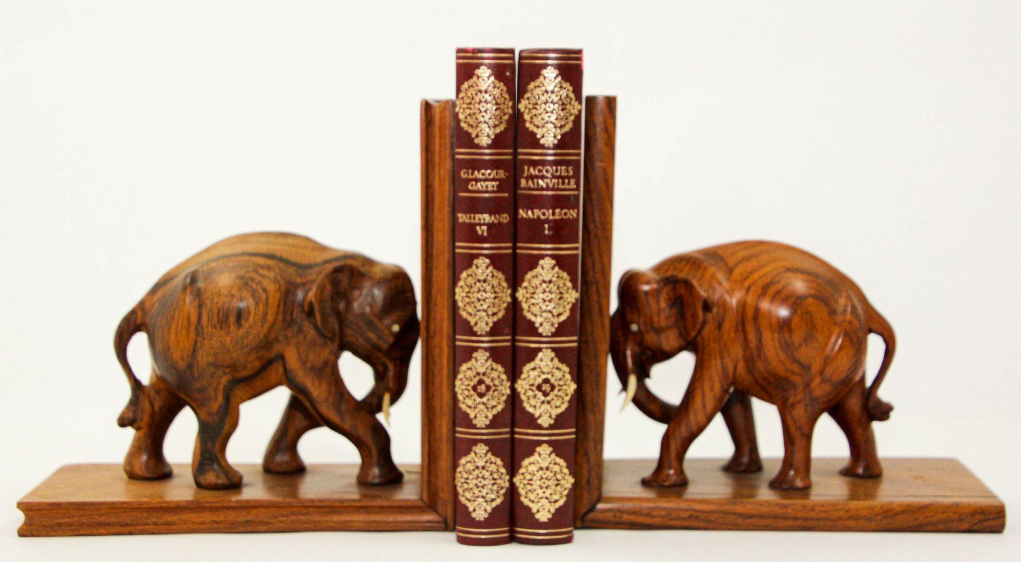 Large vintage Asian hand-carved wood elephant bookends.
Vintage 1940s wooden bookends with carved elephant sculptures carvings.
A wonderful quality pair of French Art Deco style hand-carved wooden elephant bookends.
These handcrafted set of two