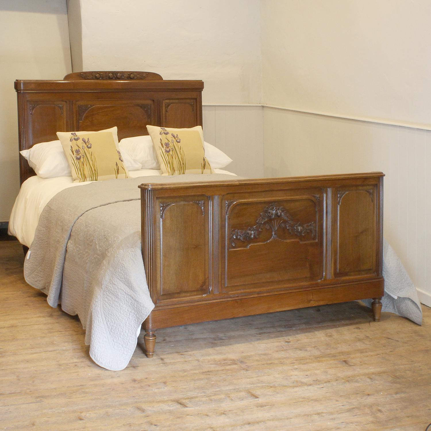 A fine Art Deco bed from walnut with turned feet and low head panel.

This bed accepts a standard double, 4ft 6in (54 in), base and mattress set.

The price is for the bed frame and a firm bed base. 

The mattress, sprung bed base, bedding and linen