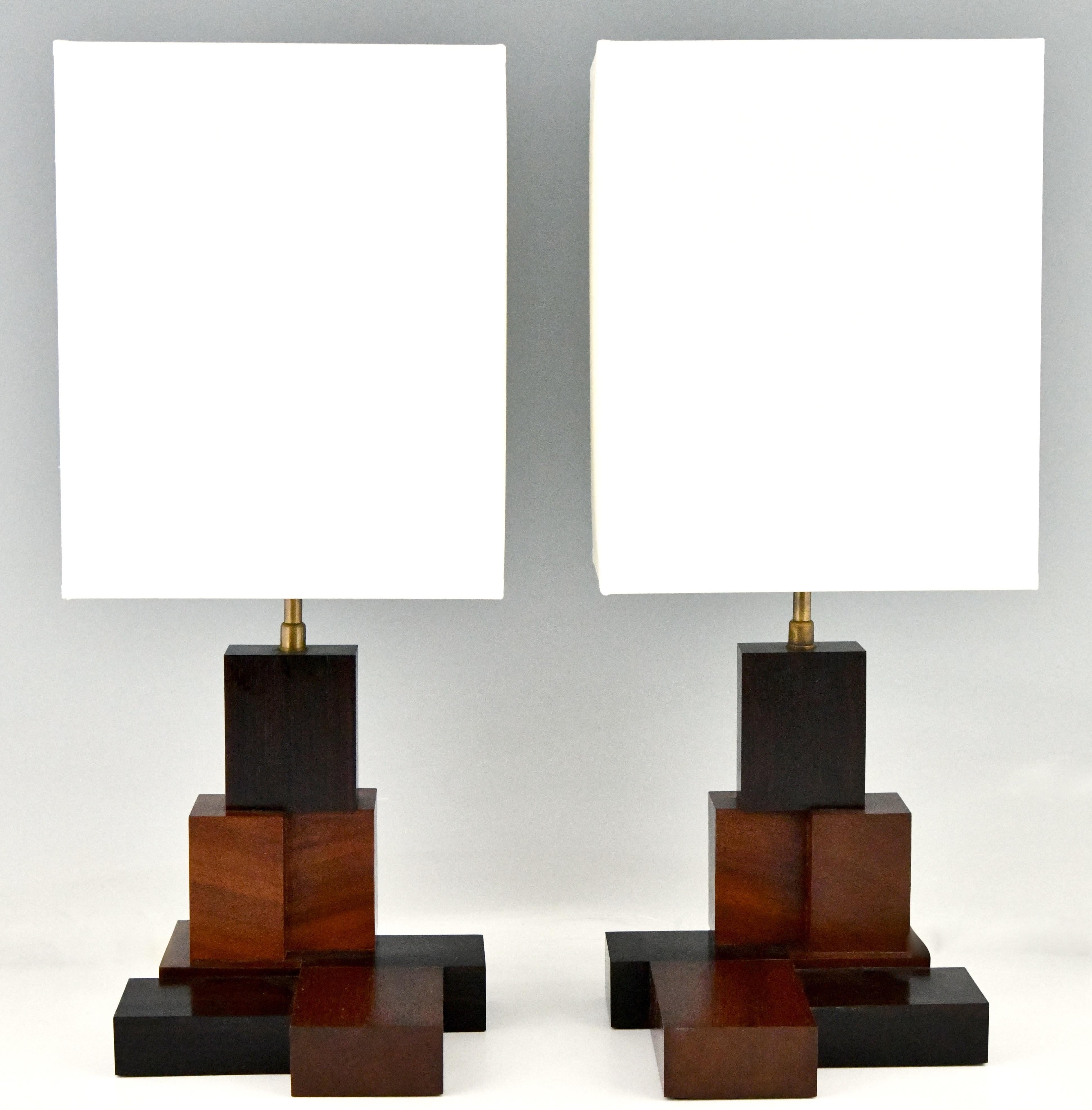 Pair of Art Deco wooden Constructivist table lamps. Handmade, sculptural wooden base. Contemporary shades. France, 1925.