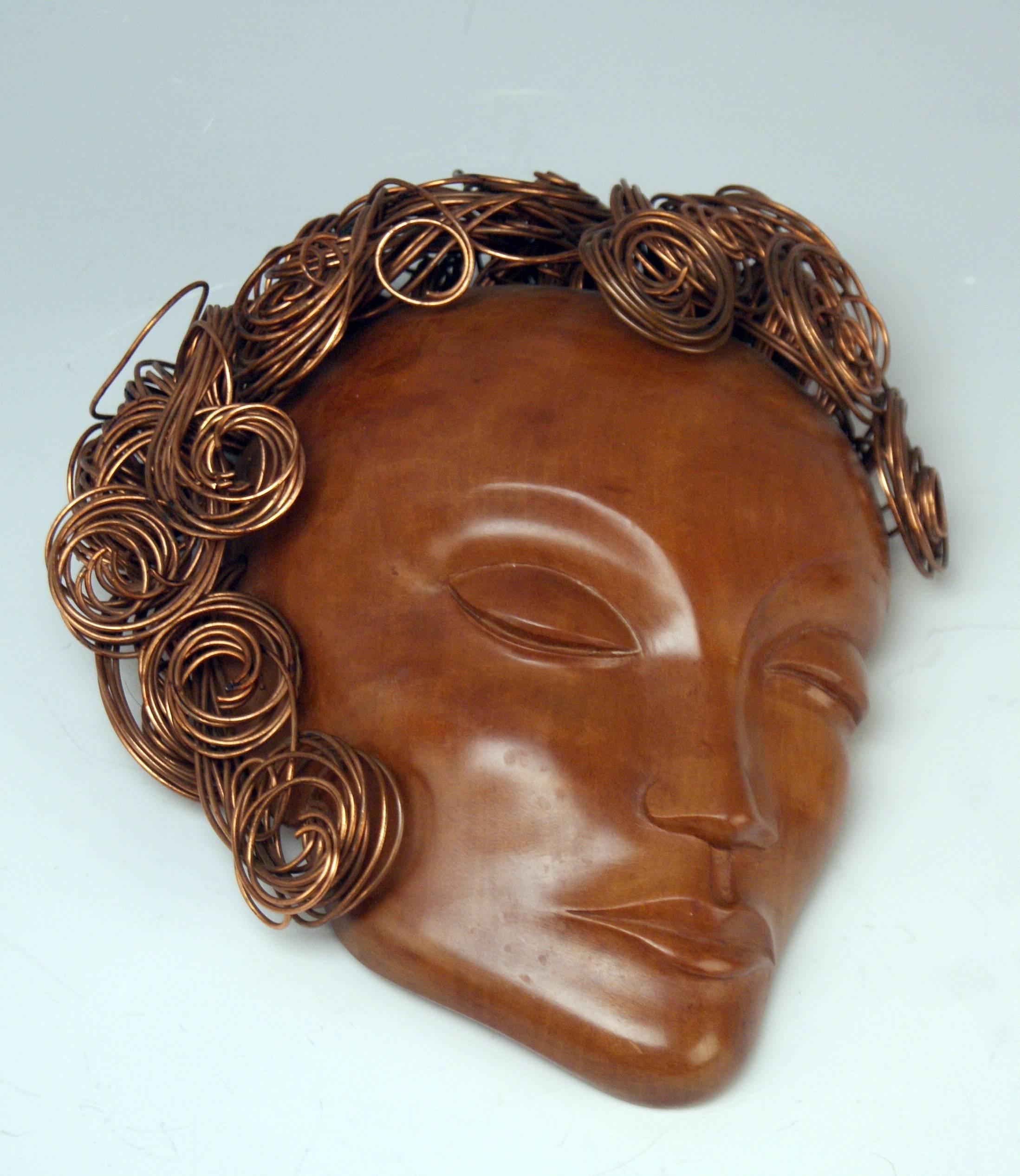 Finest Art Deco rarest Hagenauer Vienna head of a lady with curled hair:
The lady's head made of carved wood is covered with curled hair - these ones consisting of elegant curled threads made of copper. - Signed at reverse side of wooden head by