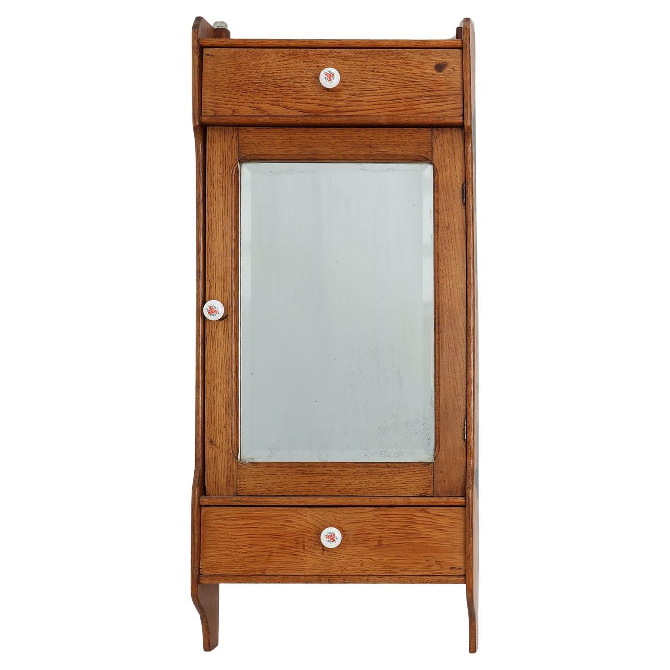 Mobile da parete in legno Art&Deco con porta a specchio e 2 cassetti, Francia ca. 1900