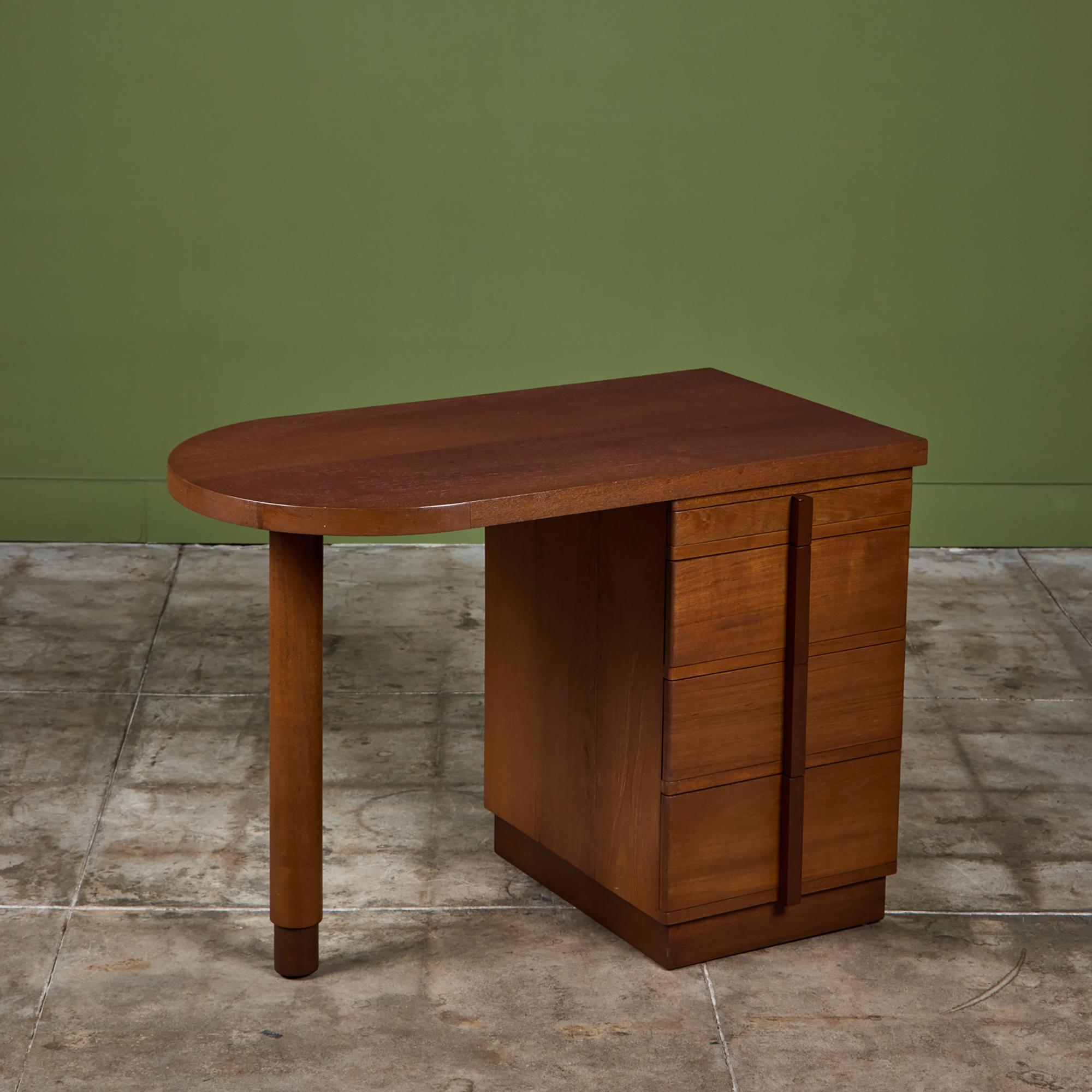 Art Deco walnut writing desk features a curved desk top with a flat edge. One side of the dresser has four drawers while the other side has a single leg dowel leg.

Dimensions 
40