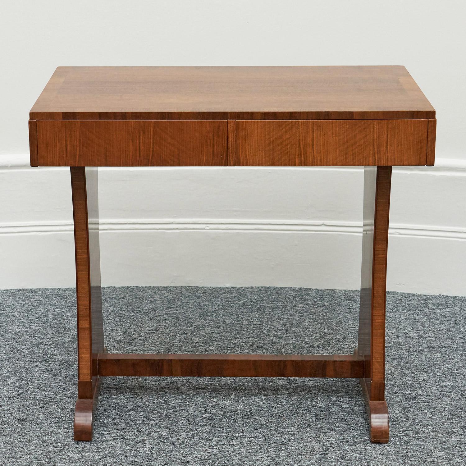 Art Deco writing desk or console table by Waring & Gillow. Burr & Figured walnut veneered throughout. Labelled 'Waring & Gillow 1932' to inside of left drawer. 

Dimensions: H 84 cm, W 91 cm, D 53 cm 

Origin: English

Date: Circa 1930

Item