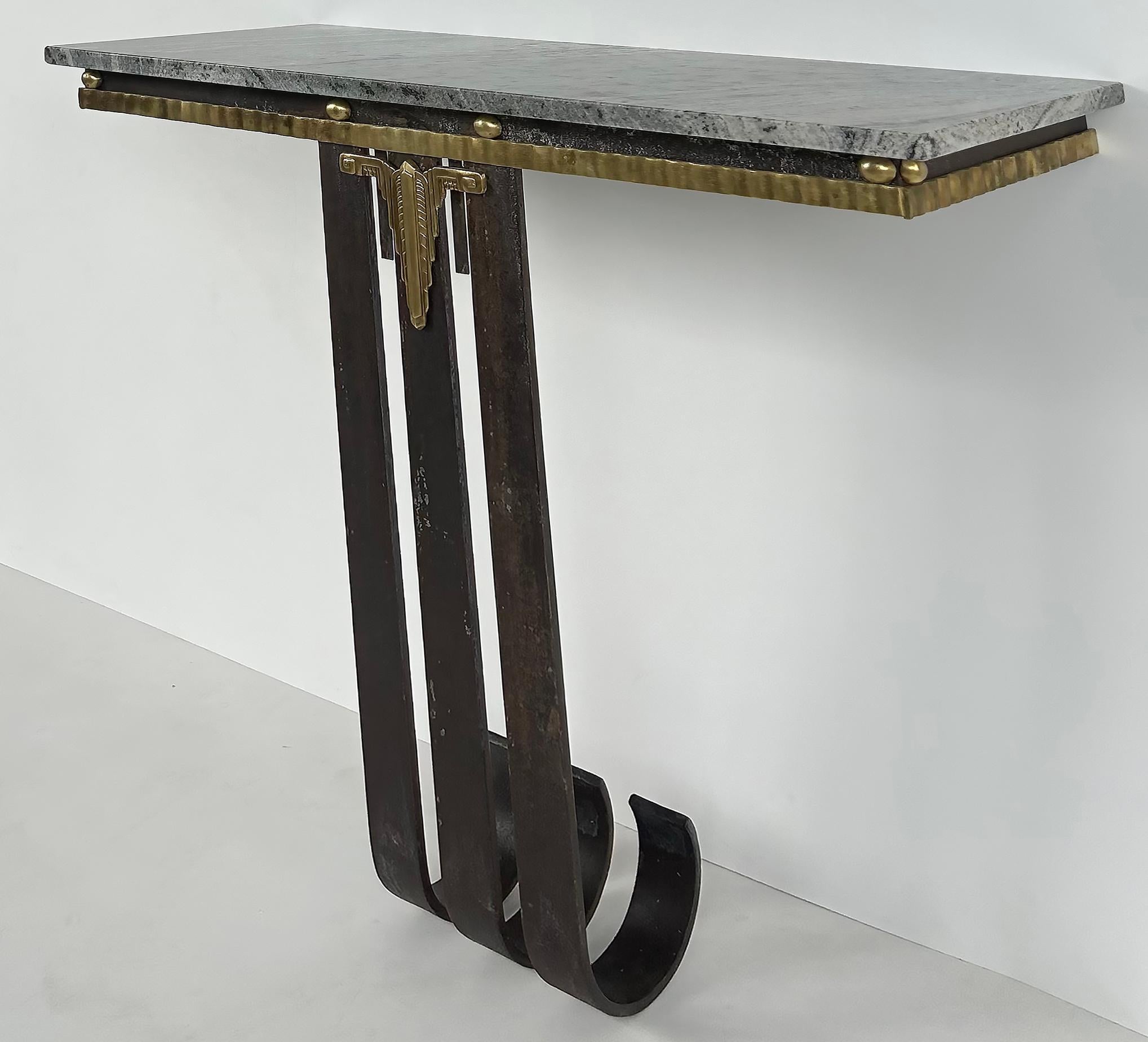 
Art Deco Wrought Iron, Brass, Marble Console Table, Subes Manner

Offered for sale is a finely crafted Art Deco wall-mounted console table in brass, wrought iron, and marble. The console is created in the manner of Raymond Subes with substantial