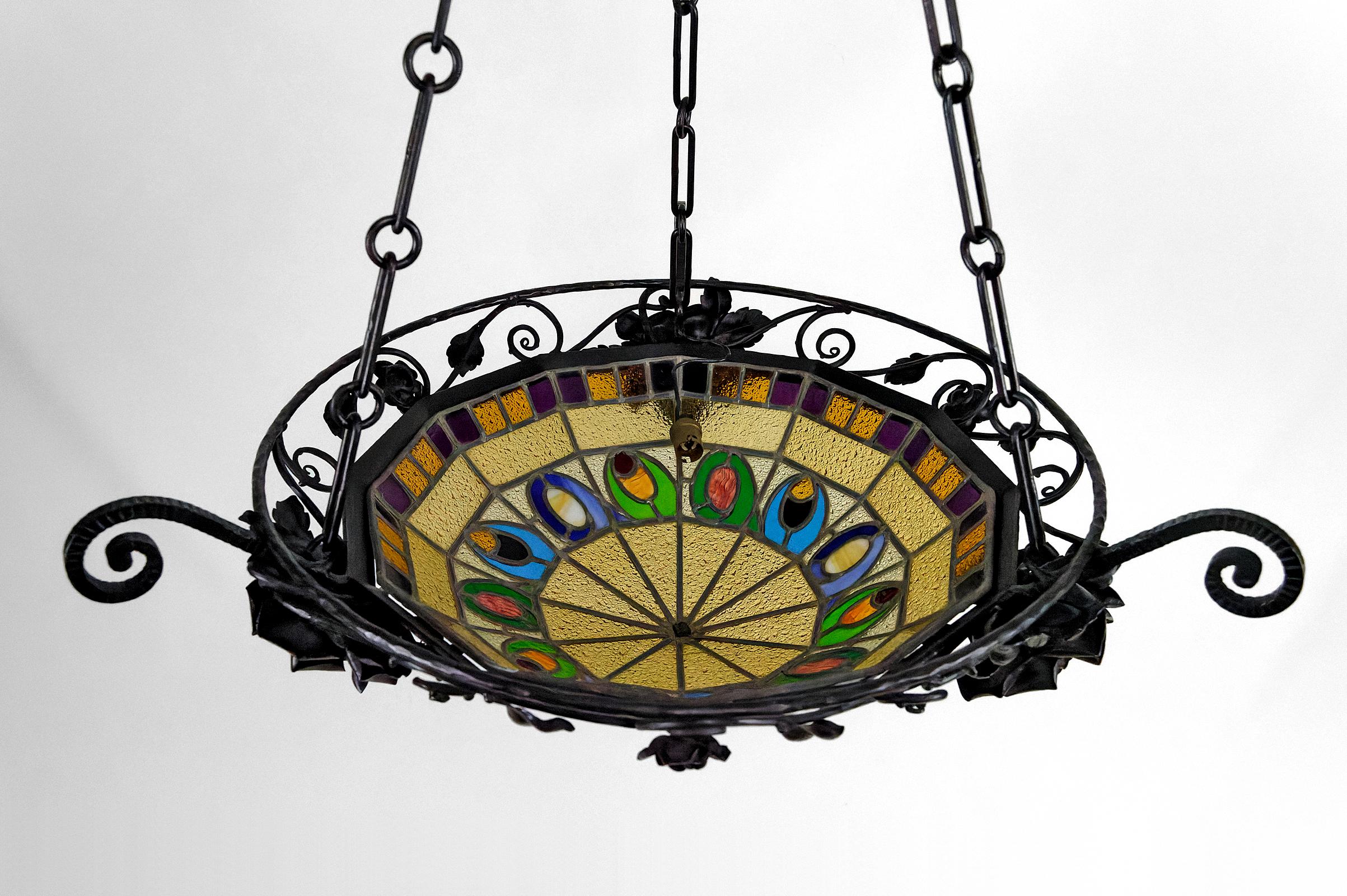 Stained Glass Art Deco wrought iron chandelier by Augustin Louis Calmels, France, Circa 1920 For Sale