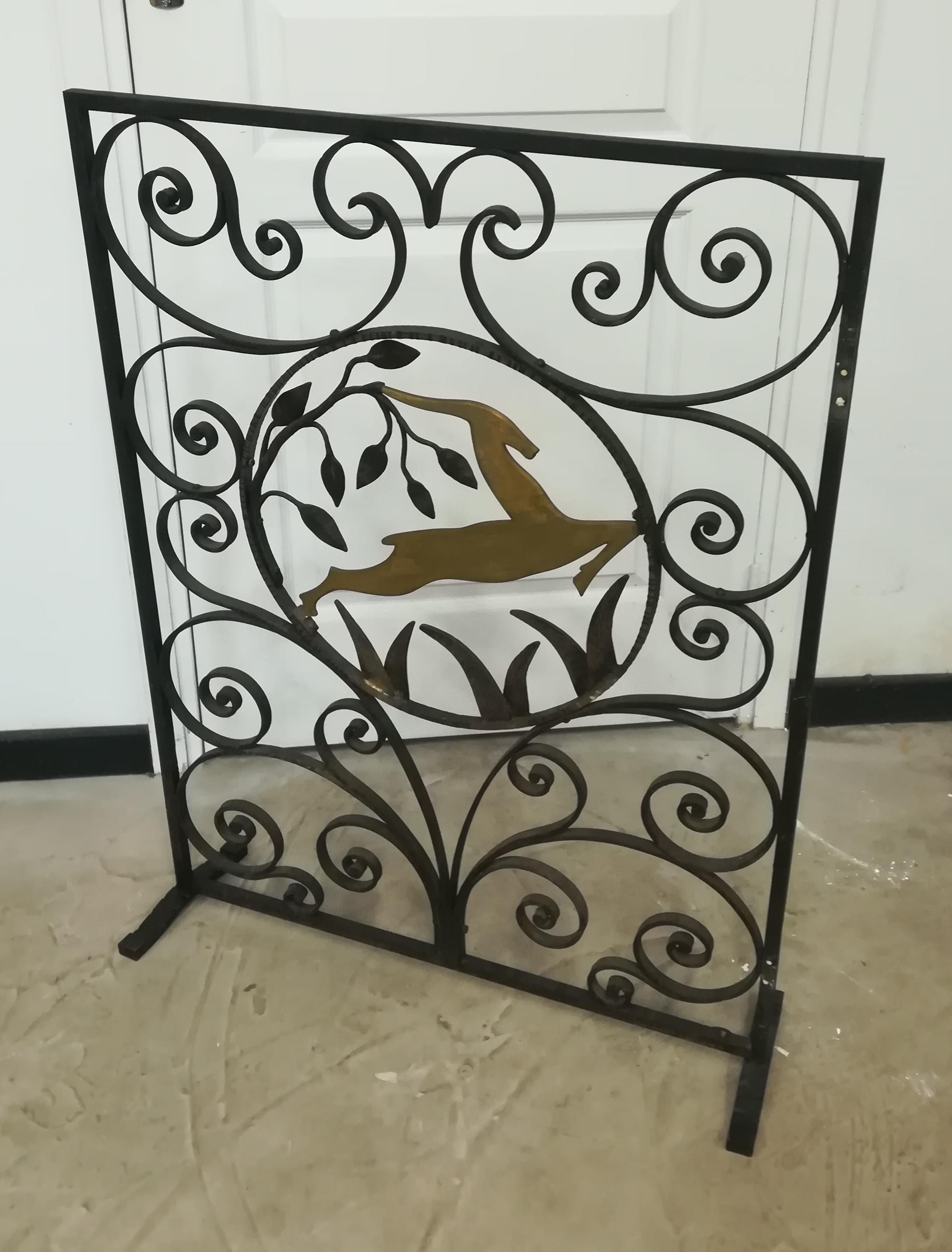 Art Deco wrought iron fire screen, with golden antelope, double sided.
Measures: Thickness 1.5cm.
  