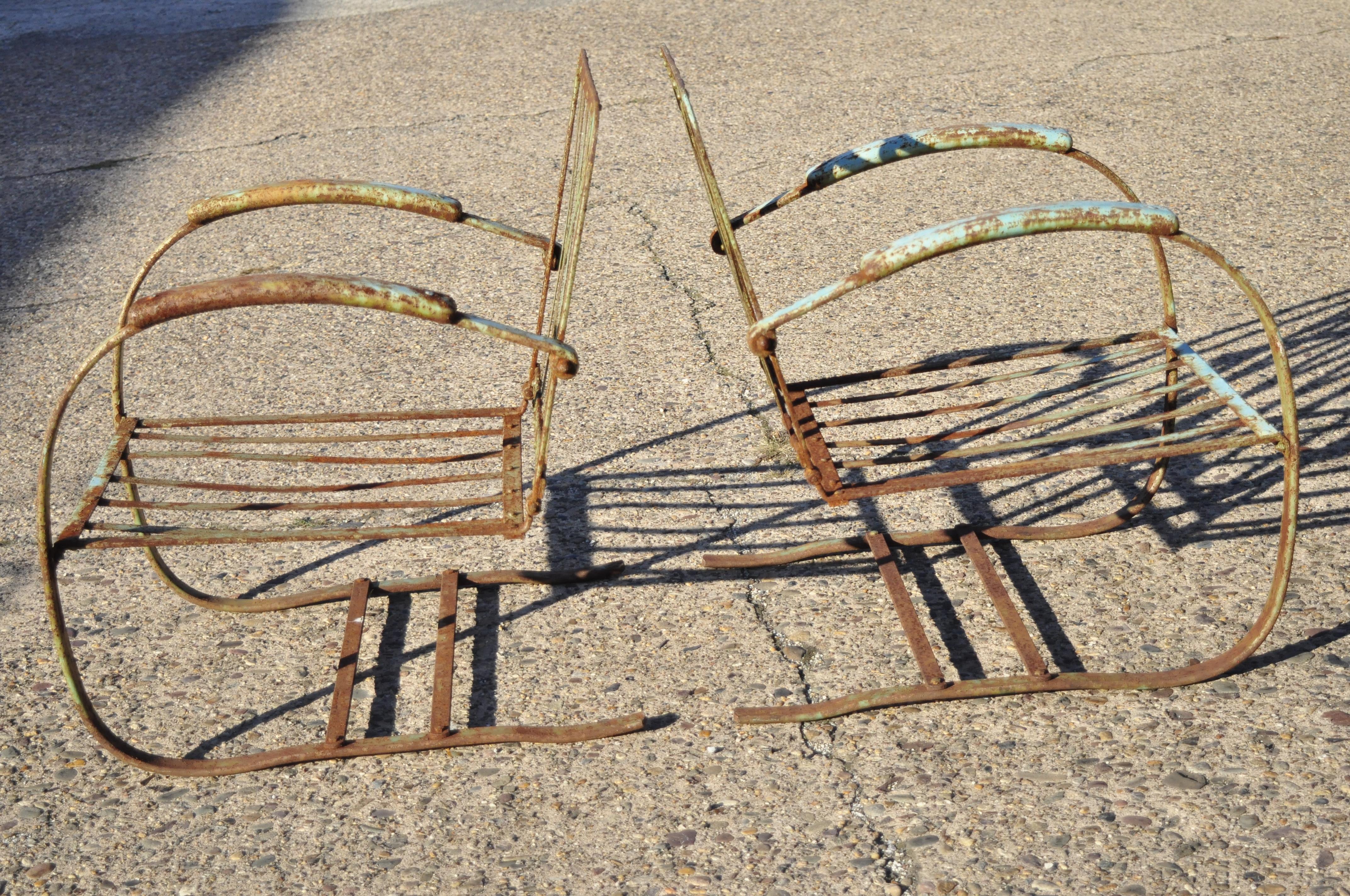 Art Deco wrought iron green distress painted outdoor patio bouncer lounge chairs - a pair. Item features bouncer frames, green distressed painted finish, wrought iron construction, distressed finish, very nice antique item, great style and form,