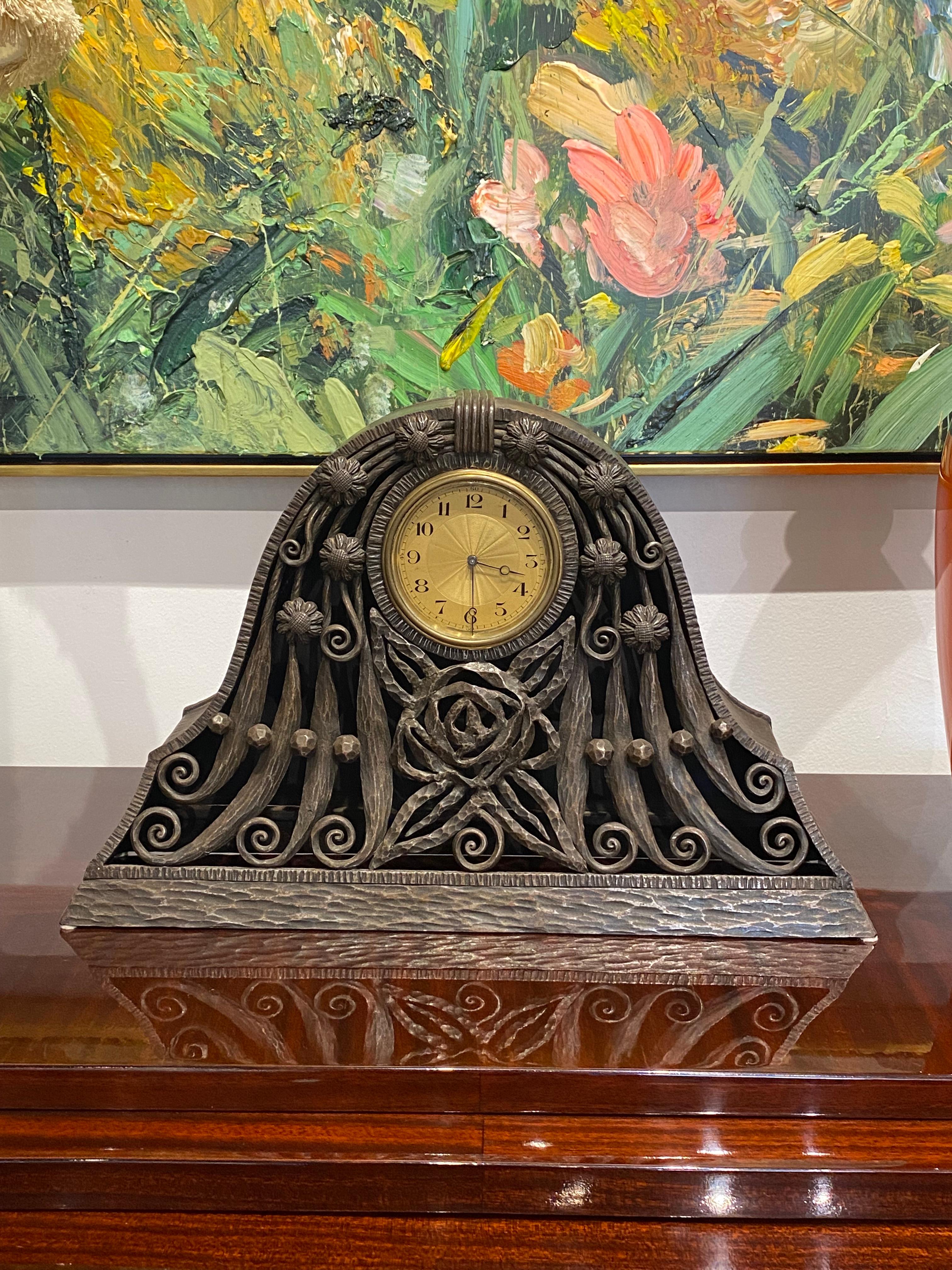 Art Deco mantle clock made of wrought iron depicting deco flowers.
Made in France
Circa: 1925.