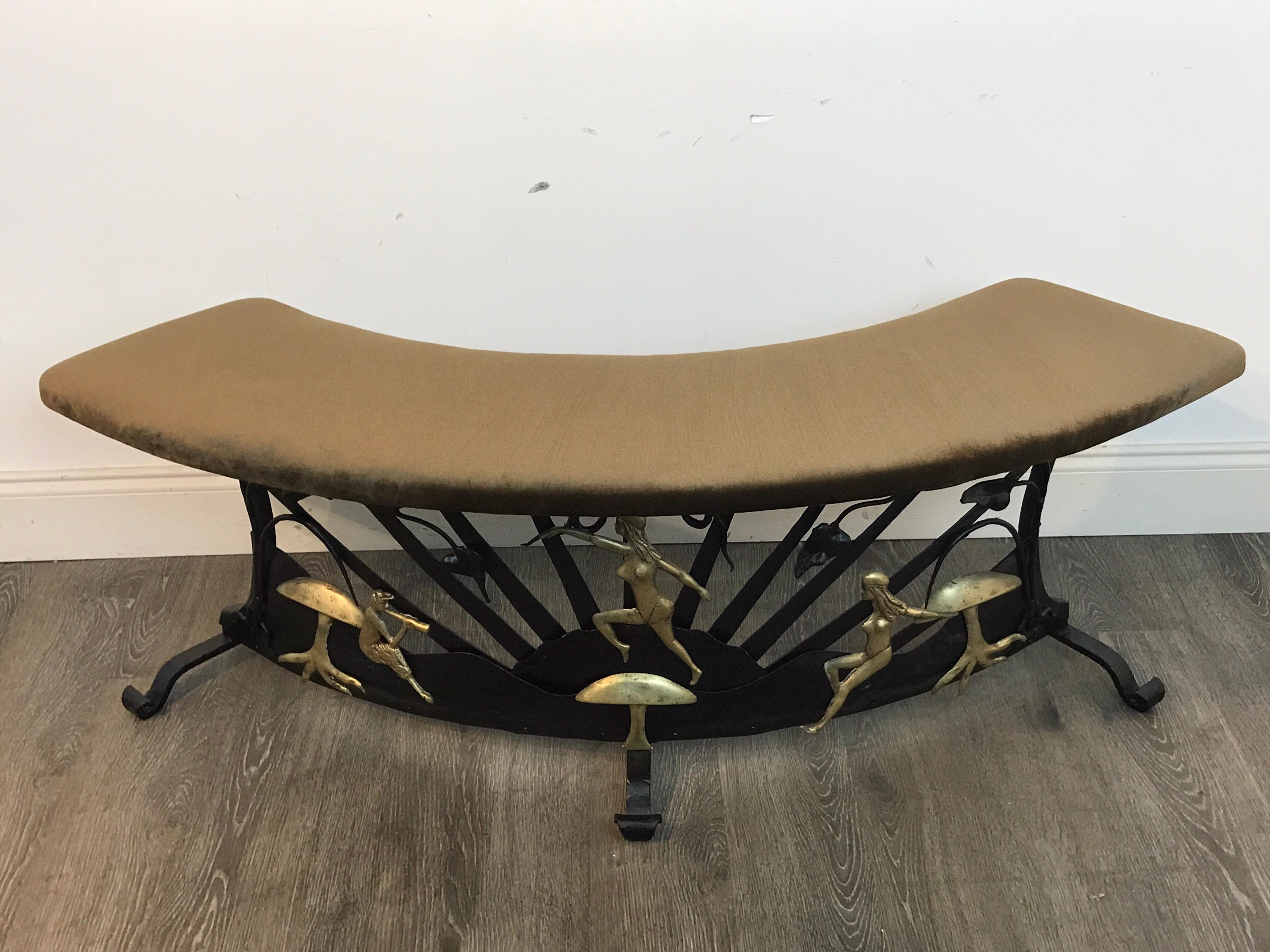 Art Deco wrought iron semi -circle fireside bench, enchanted garden motif, with a newly upholstered Kravet brown velvet top, raised on a base with brass mushrooms, satyrs and nudes in landscape, Could be used in front of a fireplace or any interior