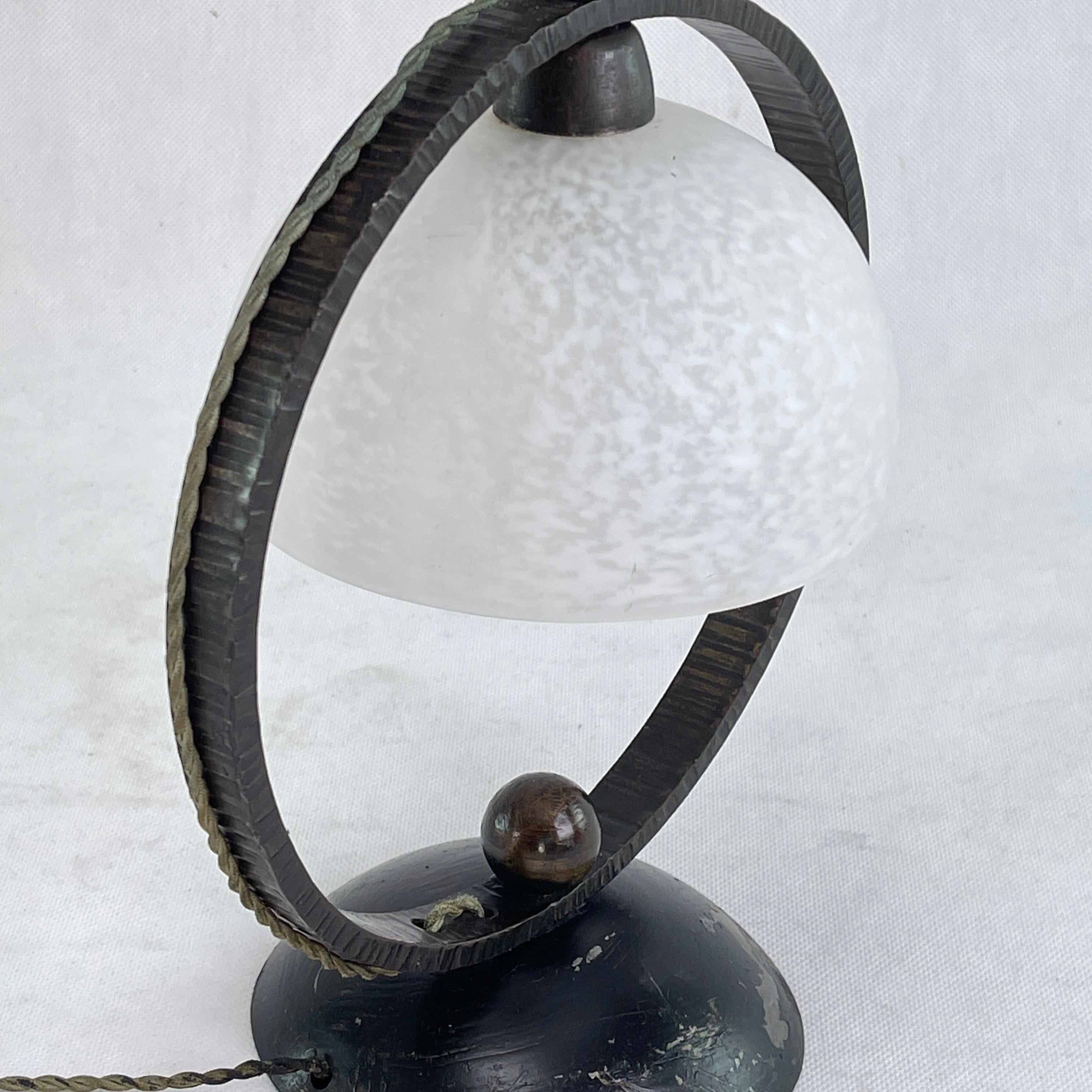 Art Deco desk lamp by Schneider - 1930s.

This beautiful reading lamp / bedside lamp from the 20s / 30s of the last century comes from France. The Pate de Verre glass shade signed 