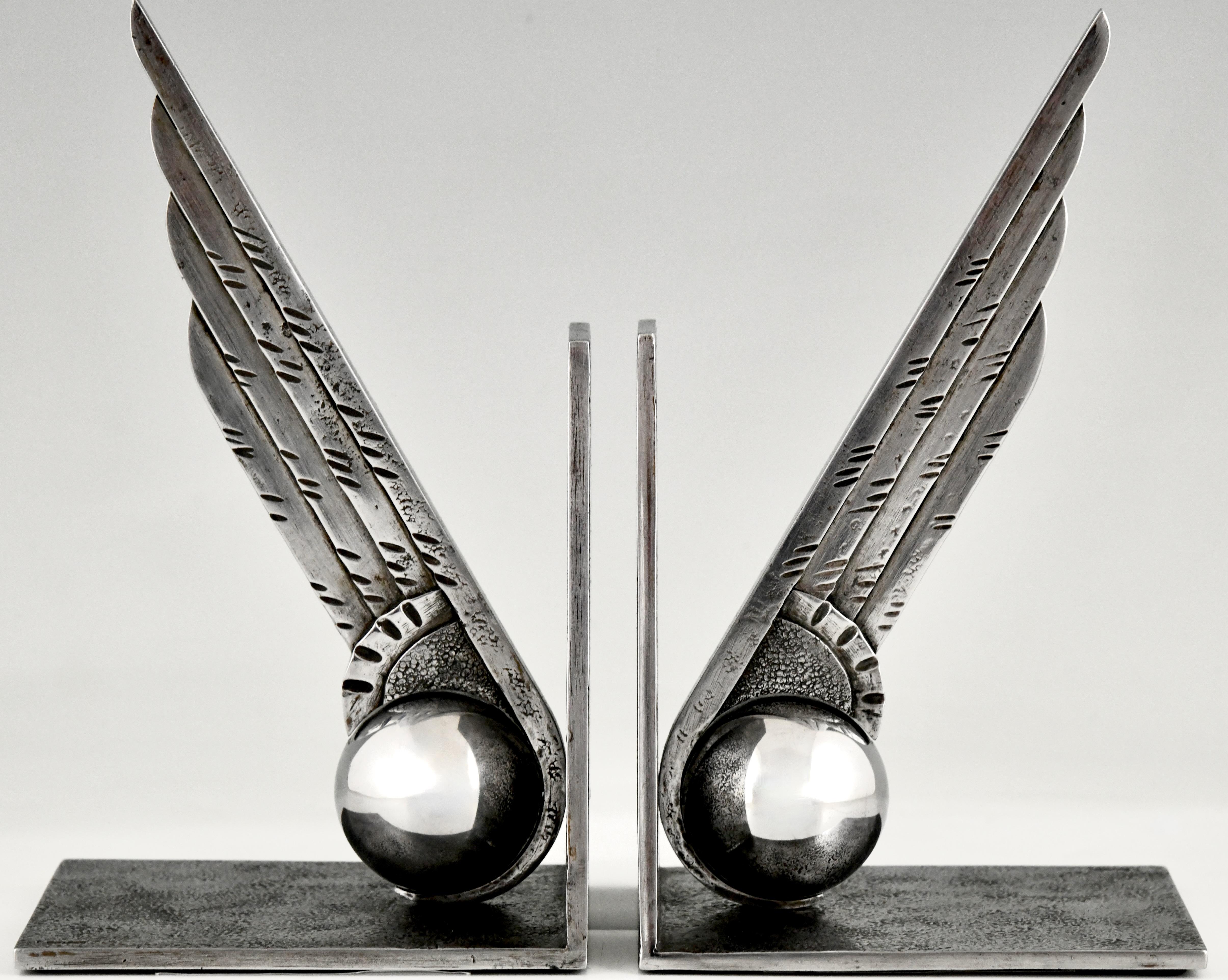 Art Deco wrought iron wing bookends by Edgar Brandt.
France 1930
These bookends are illustrated in:
Art Deco sculpture, Alastair Duncan.
Literature:
Edgar Brandt master of Art Deco ironwork, Joan Kahr. 
A pair of Art Deco wrought iron bookends are