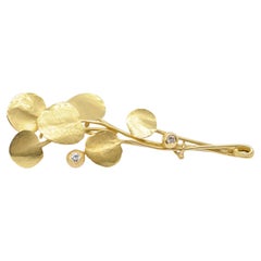 Art Deco Wurzbacher yellow gold brooch in 18k with diamonds