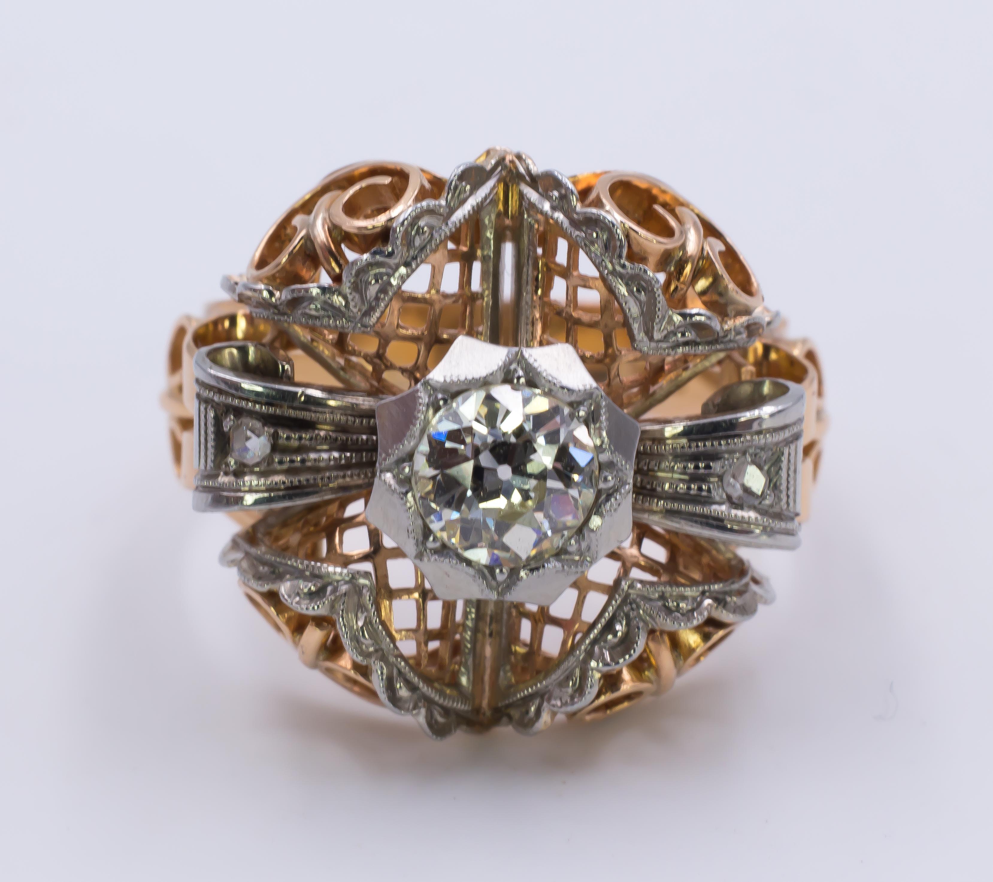 This stunning antique ring is a super example of the Art Deco period: it dates from the 1930s/'40s and it is set with a 1.09ct central diamond; the head of the ring is very articulate and with some particular shapes, decorated with diamonds and