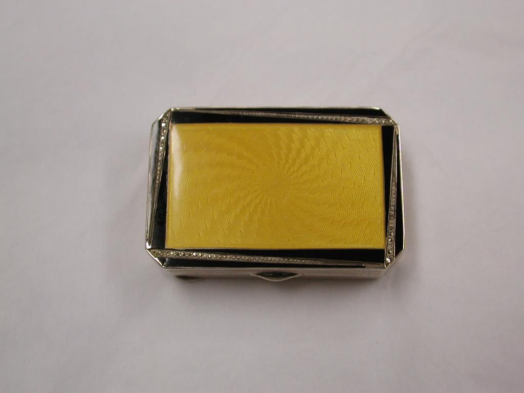 Art Deco yellow, black and marcasite silver box, P H Vogel, London, 1928
Engine turned around the sides and underneath, with gilt interior.