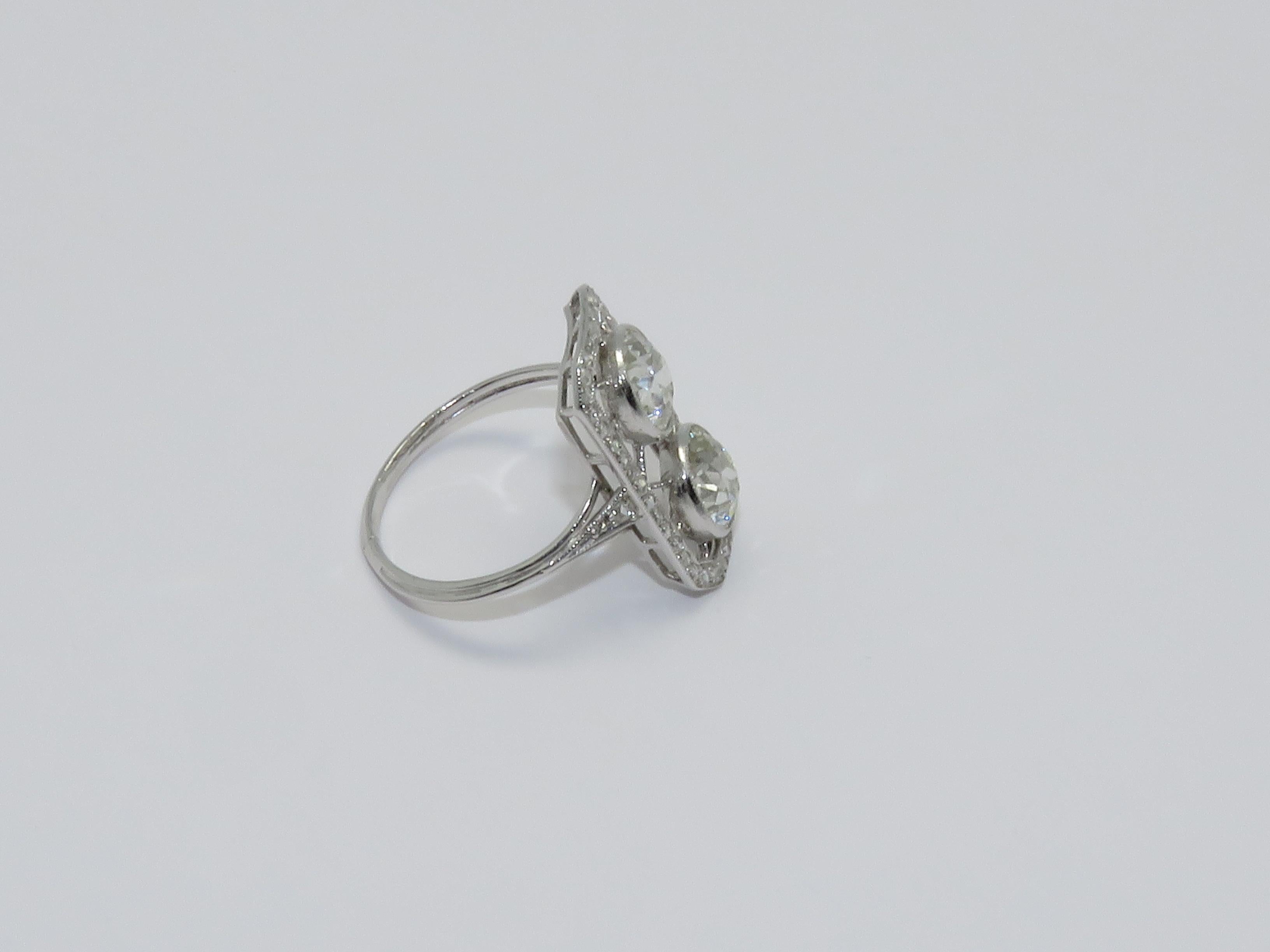 Art Deco bypass ring in Diamonds and Platinum.
Diamond Old European Cut Diamond approximately: 2 x 1.40 Ct

Ring size: 56      7 1/4 US

Measurements:
Length: 0.83 in ( 2.10 cm )     Width: 0.47 in ( 1.20 cm )     Height: 0.87 in ( 2.20 cm )    