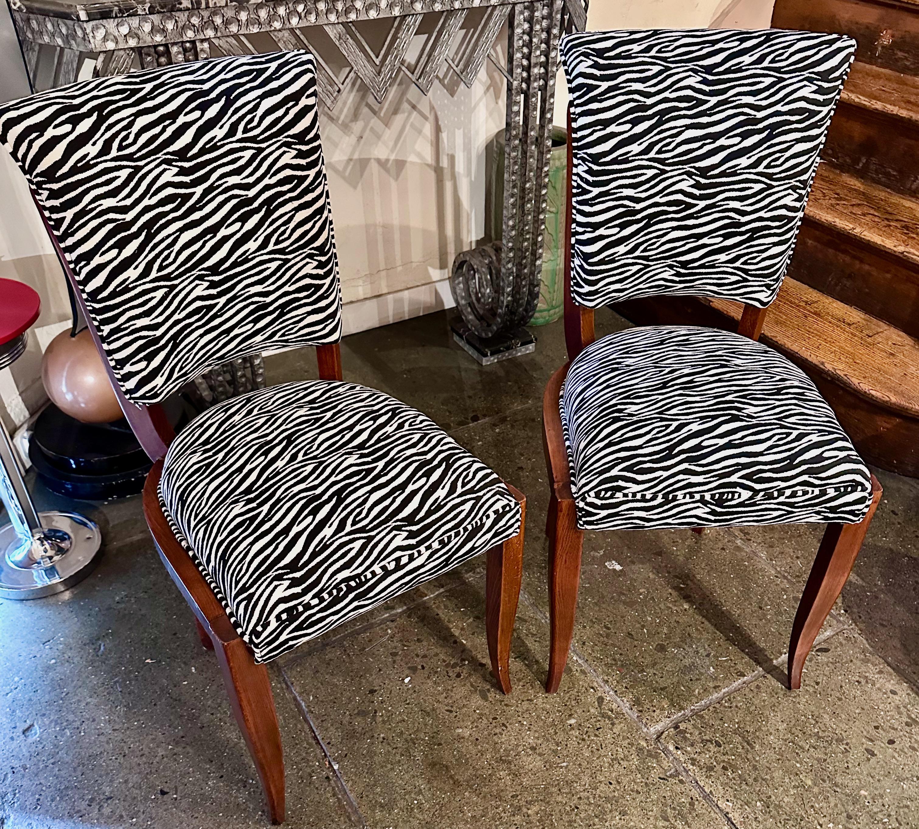 Art Deco Zebra Style Matching Pair of Side Chairs are a stunning set of two chairs from the Art Deco period. These chairs feature exposed Mahagonny wood frames that have been renewed, bringing out their original beauty.

The chairs are perfect for