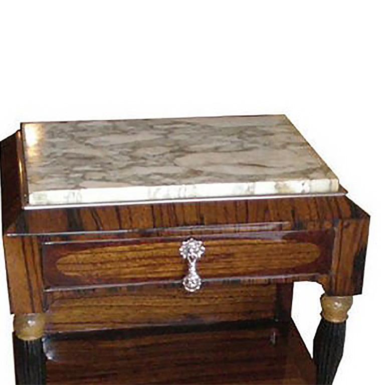 French Art Deco zebrawood table with walnut burl trim, lower cabinet door, upper drawer, and marble top.