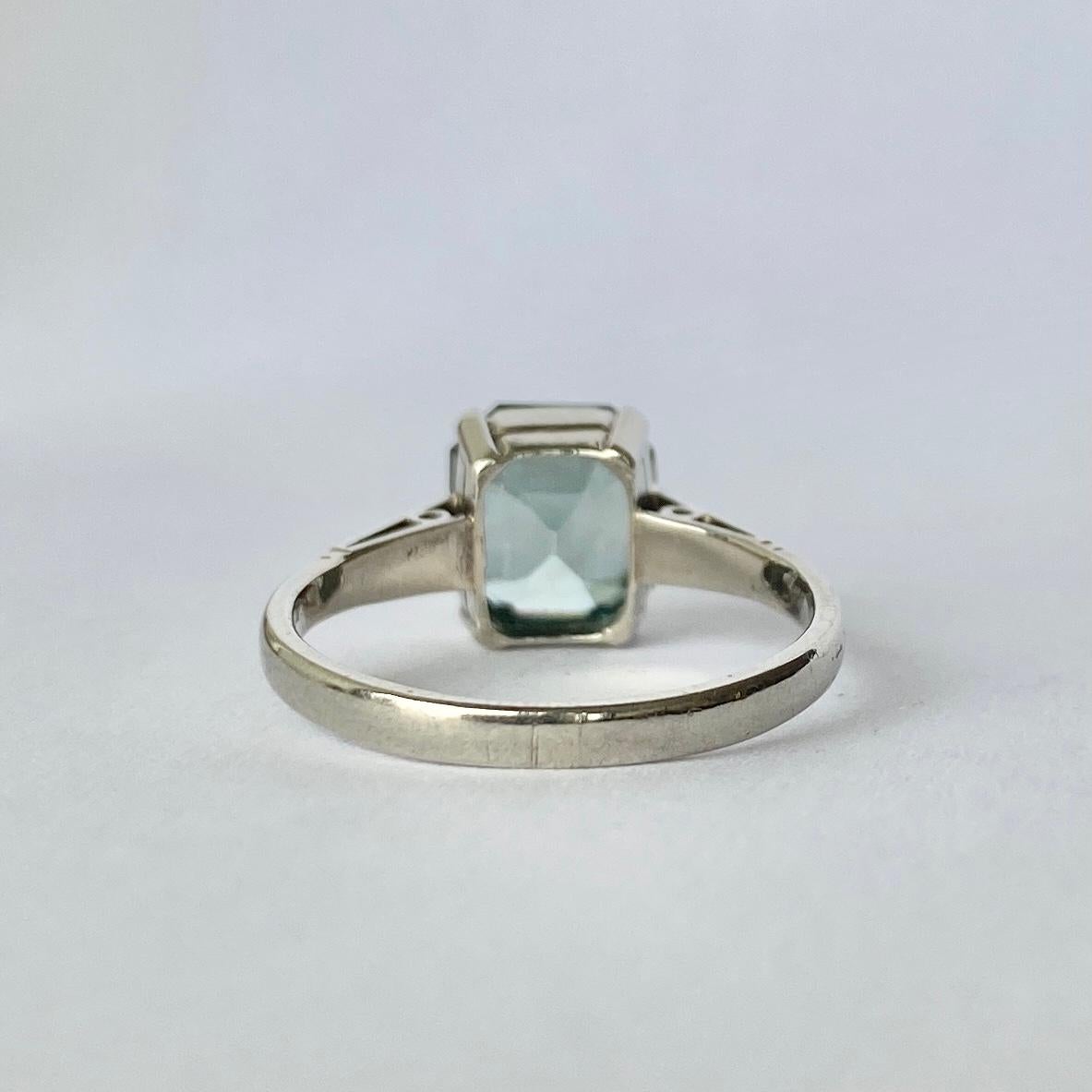 This gorgeous blue zircon is perched up in a simple gallery with claw setting and measures approx 2carat. The shoulders hold three diamond points on each side and the ring is modelled in 9ct white gold. 

Ring Size: N 1/2 or 7 
Height Off Finger: