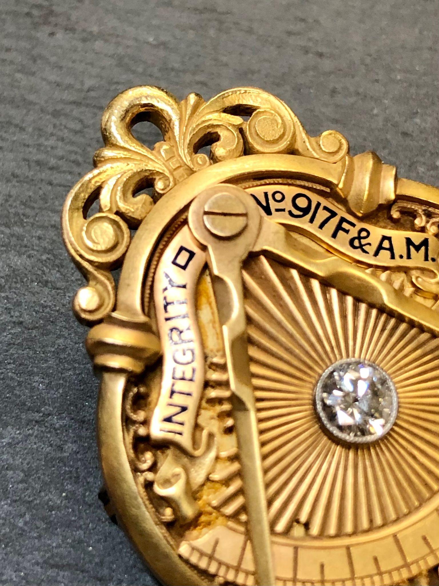 An absolutely incredible pin. The detailing is unlike anything we have ever seen in jewelry let alone Masonic jewelry. It is done in 18K gold and enamel and centered by an approximately .25ct H-I color Vs1 clarity old European cut Diamond. The
