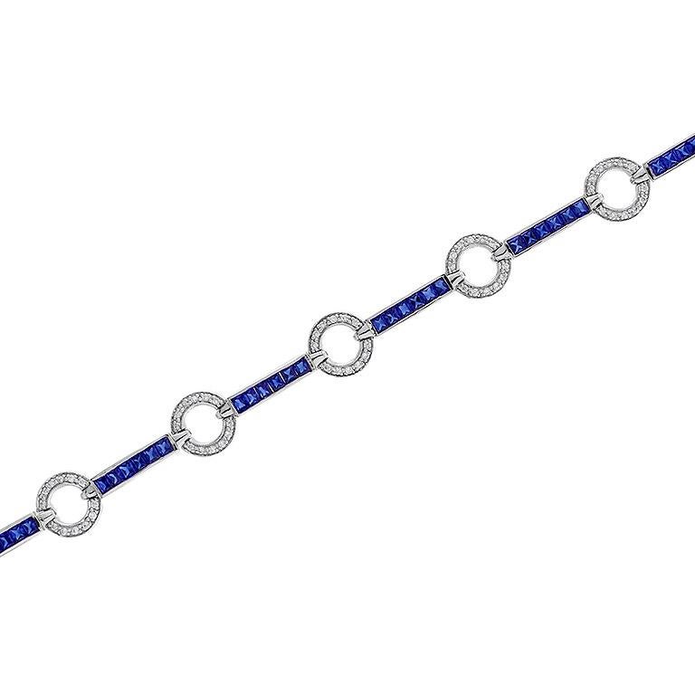 Handcrafted out of stunning blue sapphires and diamonds, this bracelet is perfect for evening or day wear. Each individual section features round diamonds and is separated from its neighbor with a sapphire line. This wonderful piece is a must-have