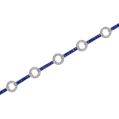 Bracelet en or blanc 18 carats avec diamants et saphirs bleus