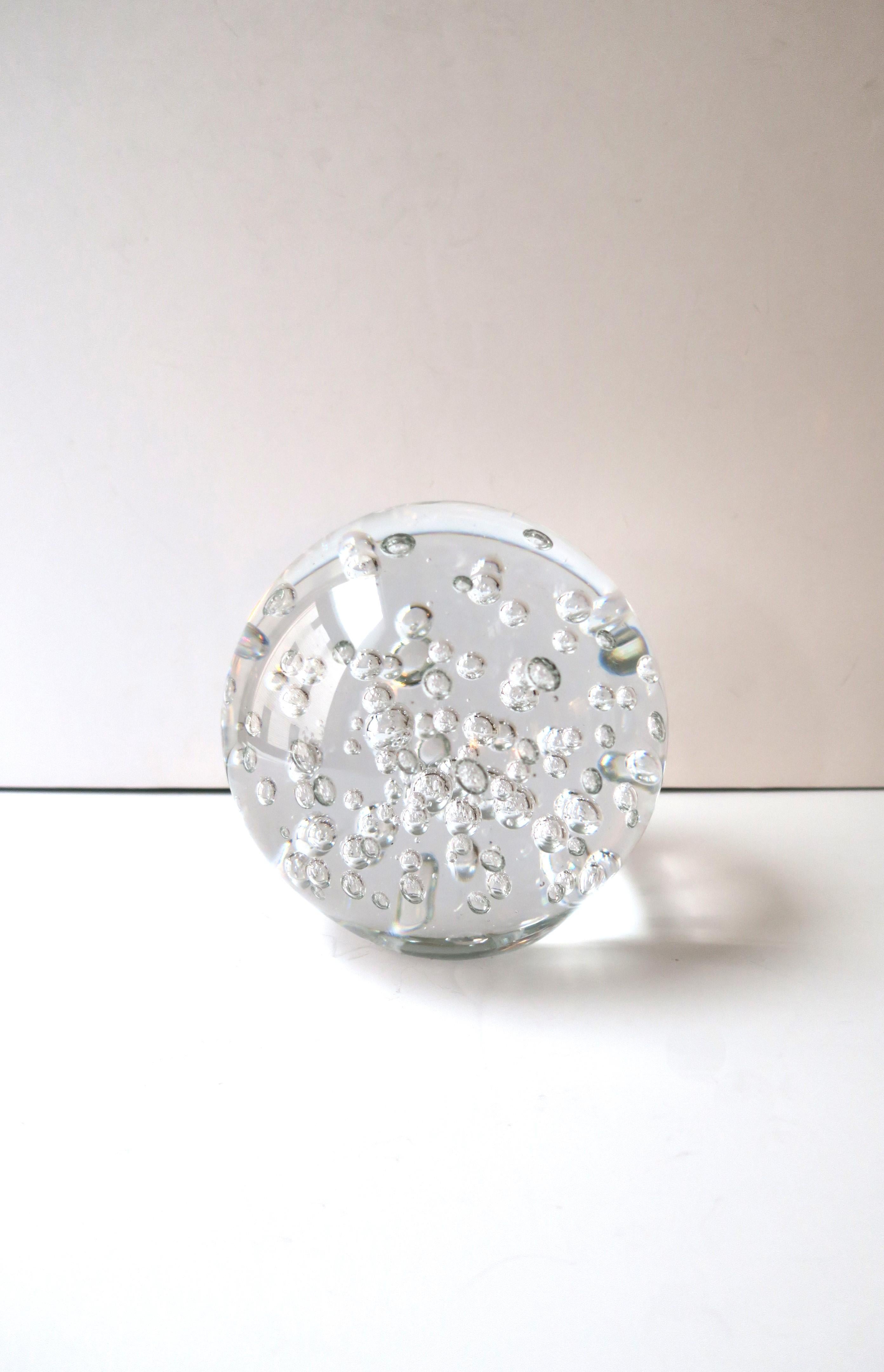 A relatively large, round, transparent art glass ball sphere with bubble design in the Modern style. A great decorative object. Place on a shelf, cocktail/coffee table, on top of books, credenza, etc. Sphere has flat bottom for stability. Excellent