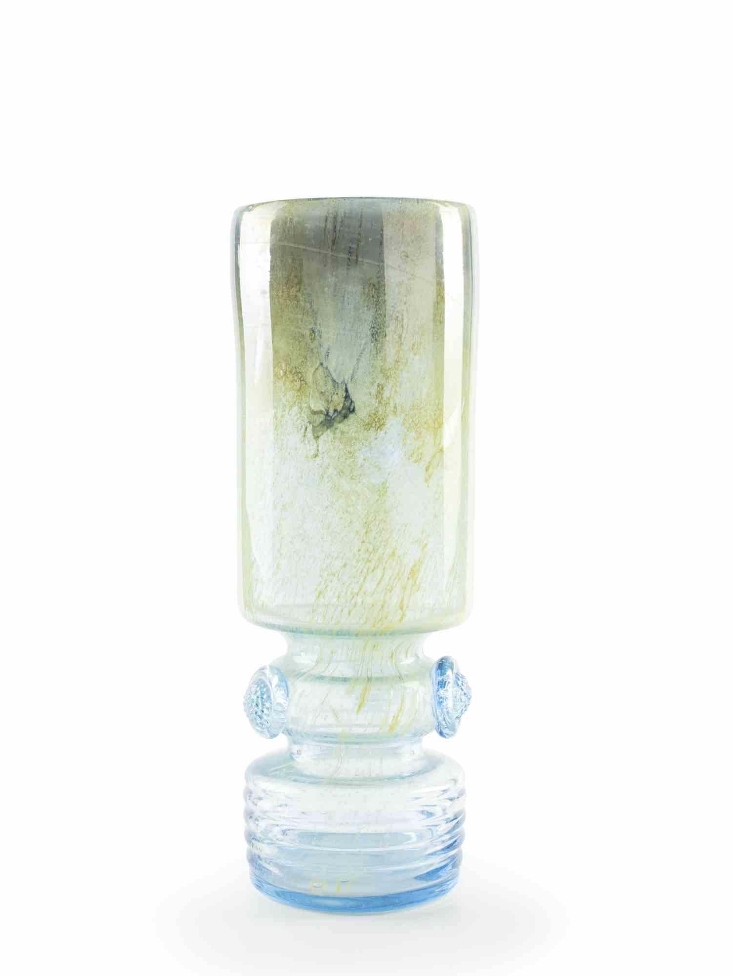 This blue glass vase realized in the 1970s by a european manufacture.

Very good conditions.

This very precious decorative object is a blue glass vase.
