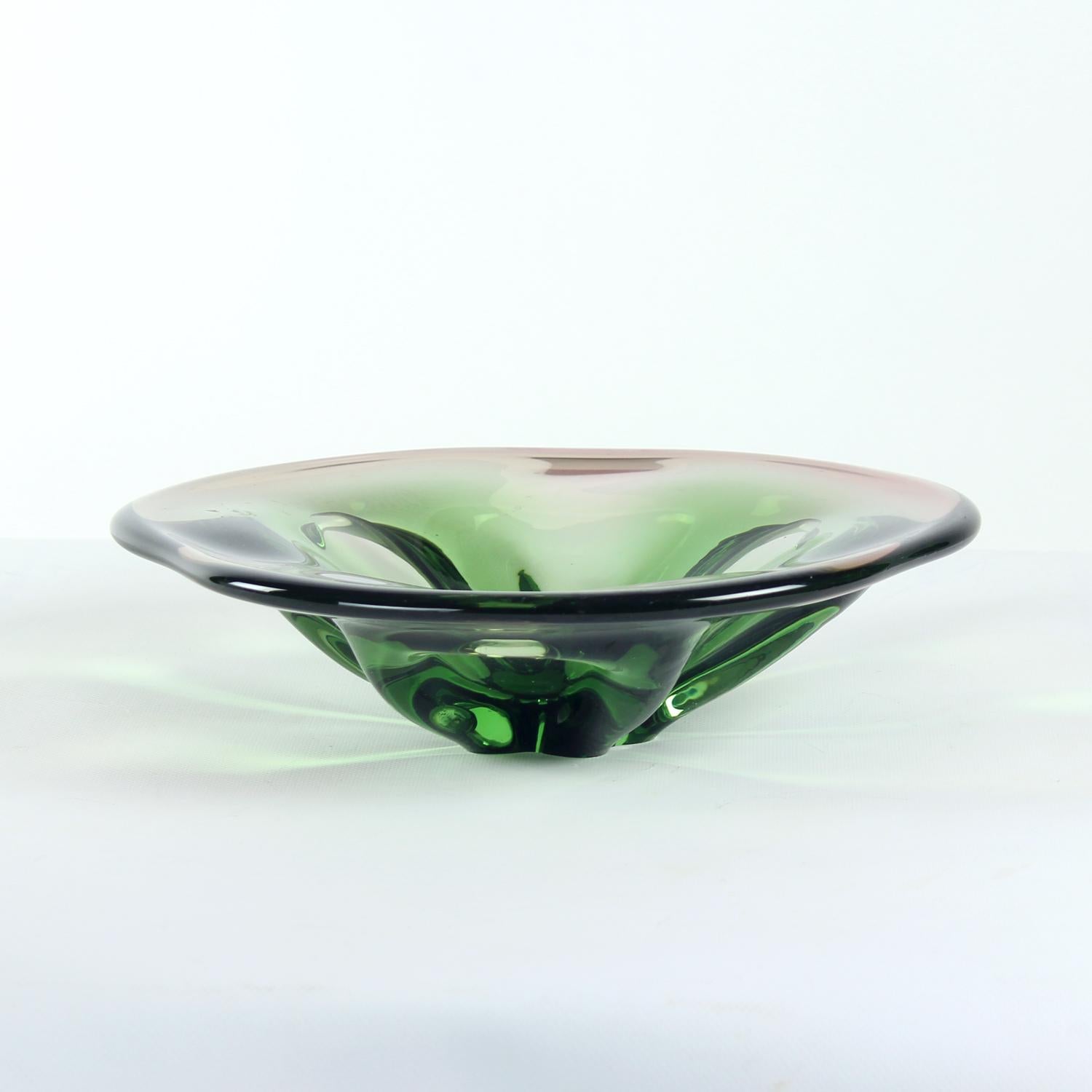 Beautiful art glass bowl by Frantisek Zemek. Produced in 1960s for Mstisov Glass Factory. The heavy art glass items are considered top notch pieces of the Czech glass era and production. This bowl is a mixture of green and pink glass moulded