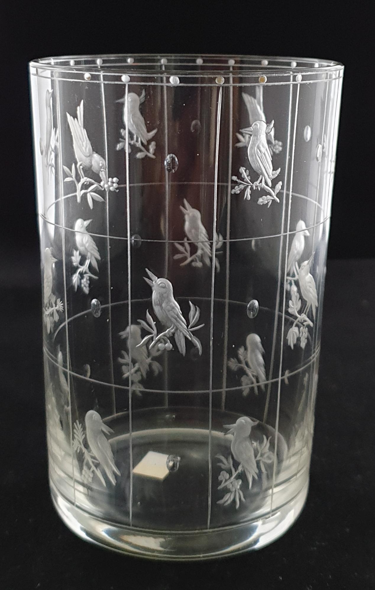 A Swedish art glass, designed by Michael Powolny, featuring blank panels alternating with birds on leafy branches.