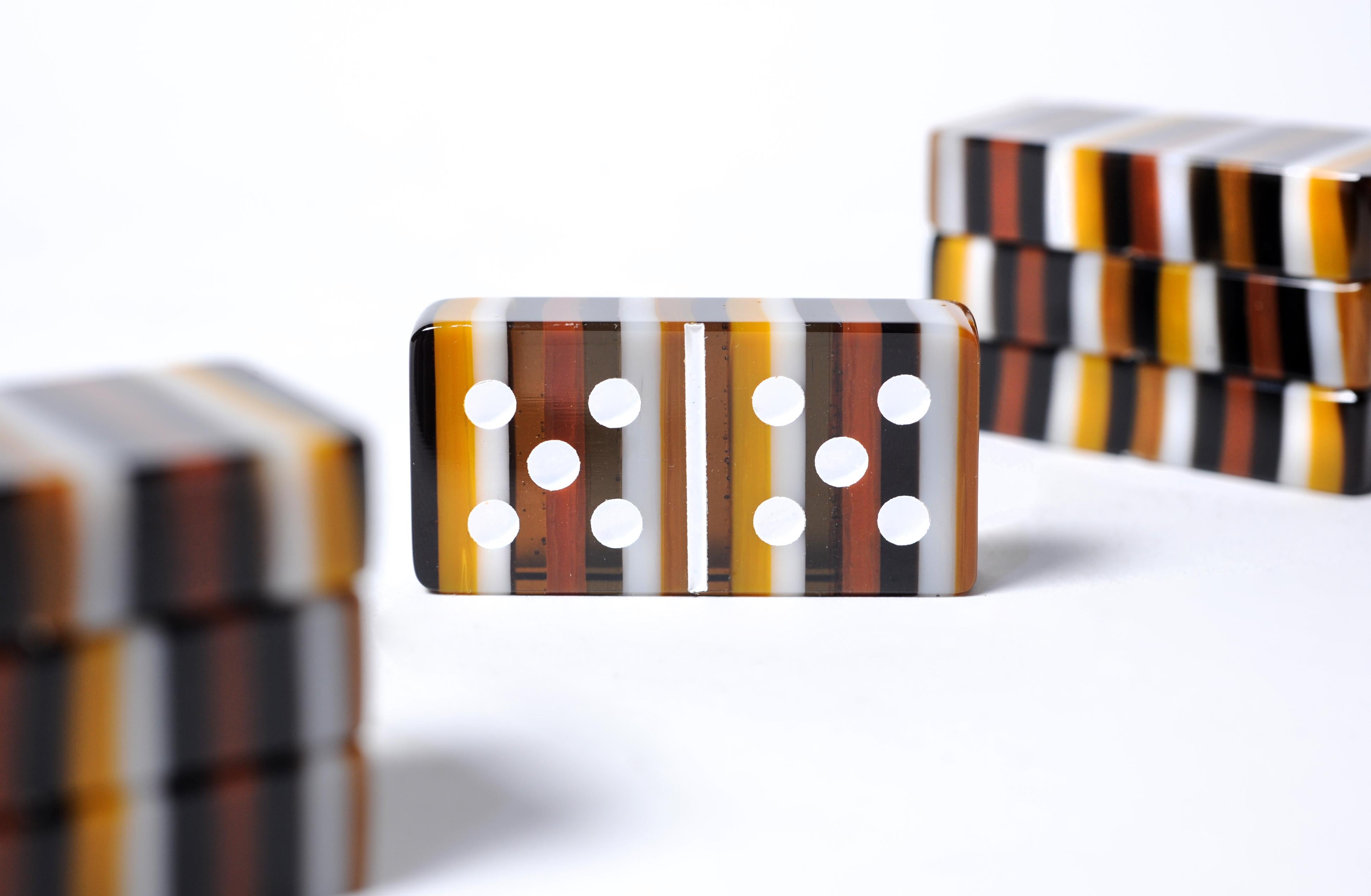 Domino is a true classic game about tactics and luck played around the globe.
Opening the case you’ll find a treasure of a 100% high quality crystal worked by Orfeo Quagliata’s artisans.

Orfeo takes his most interesting glass techniques to apply