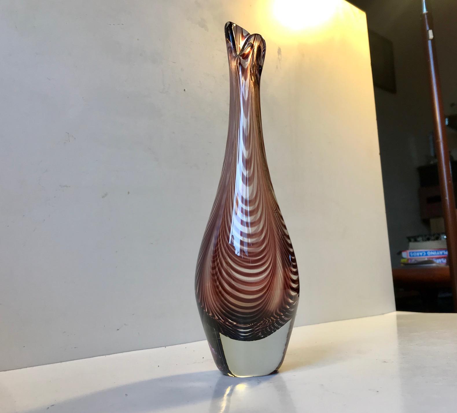 This organically hand blown vase screams Murano or Kai Franck but it is in fact Danish. The design is for obvious reasons called the duckling vase and resembles the Beak of a duck. It’s made from driven or swirl glass. This design by Lütken dates to