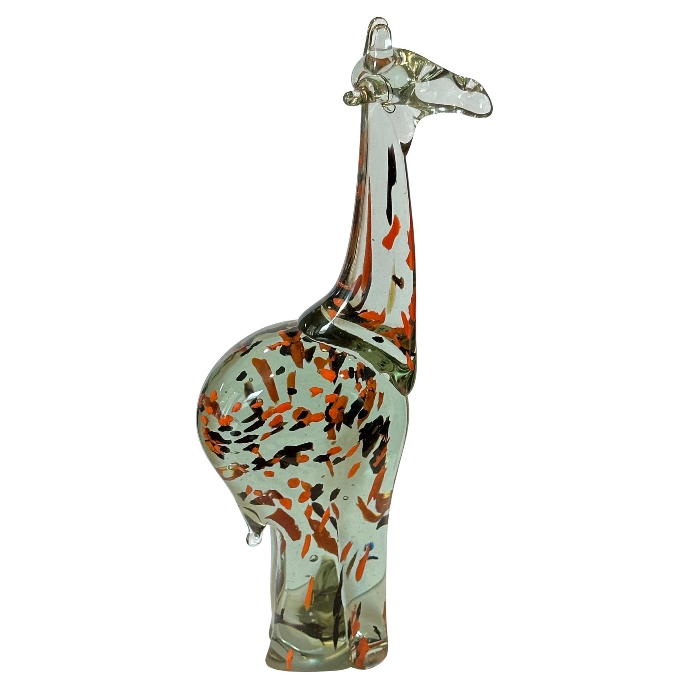 Gorgeous art glass giraffe sculpture, circa 1990s. The piece is in very good condition with no chips or cracks and measures 3.5