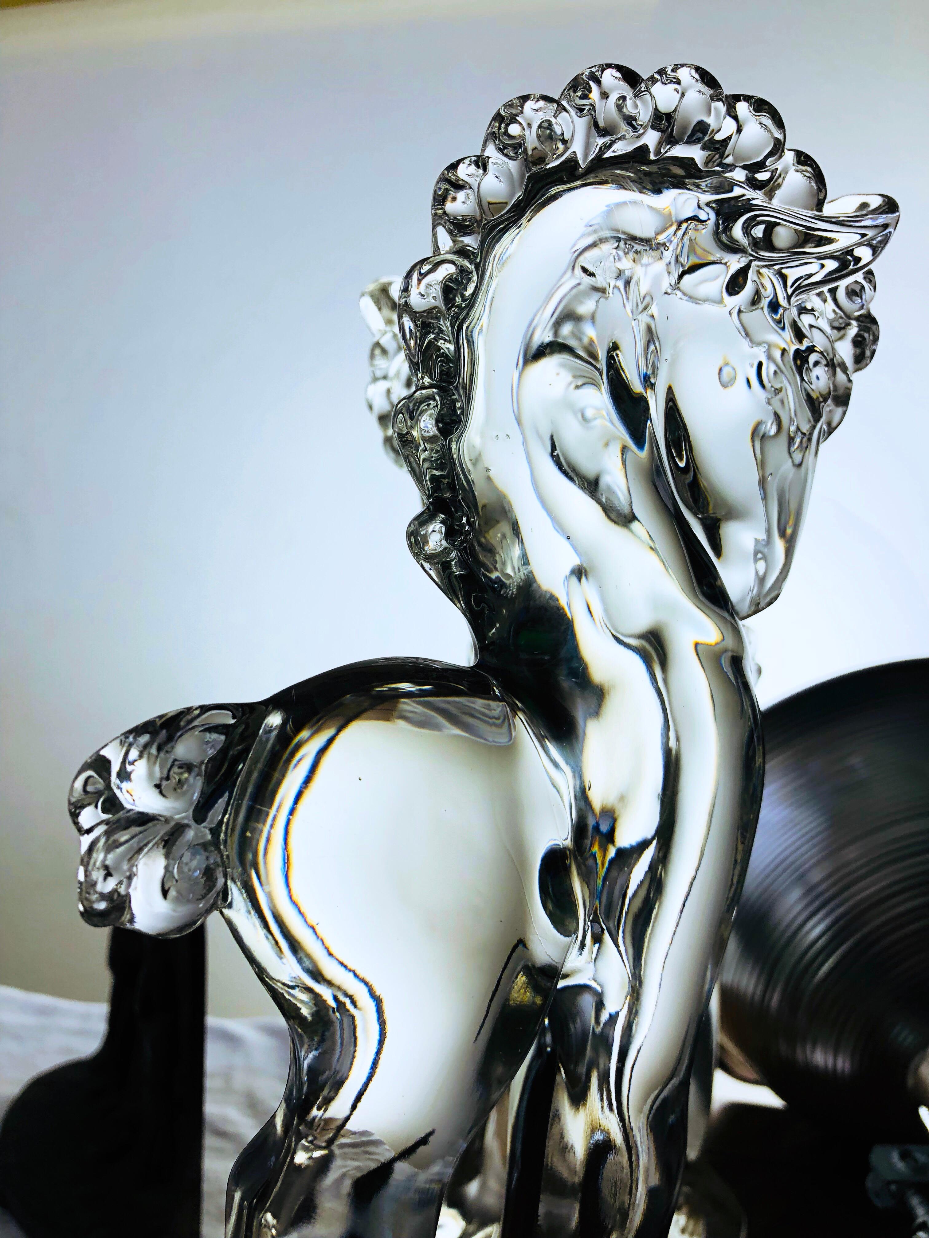 This beautiful glass horse sculpture was produced by Paden City Manufacturing Company, founded in Paden City West Virginia in 1916. This company survived only about 30 years, going out of business in 1951. Their production is perhaps the most