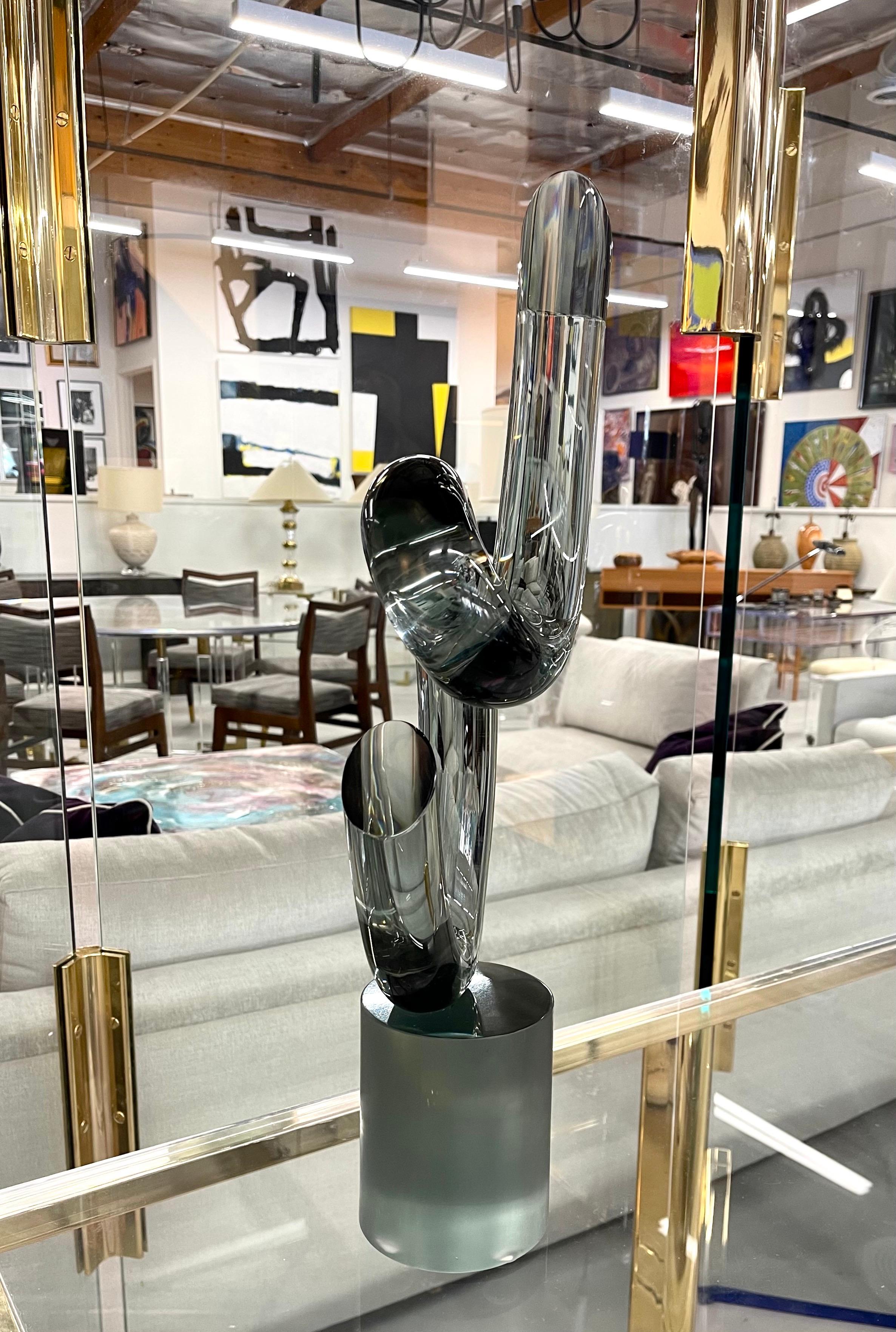 A beautiful piece of art glass by Elio Raffaeli. Signed on the base and smoky in tone. In good age appropriate condition with some minor marks particularly to the base. Approximately 22 inches tall.