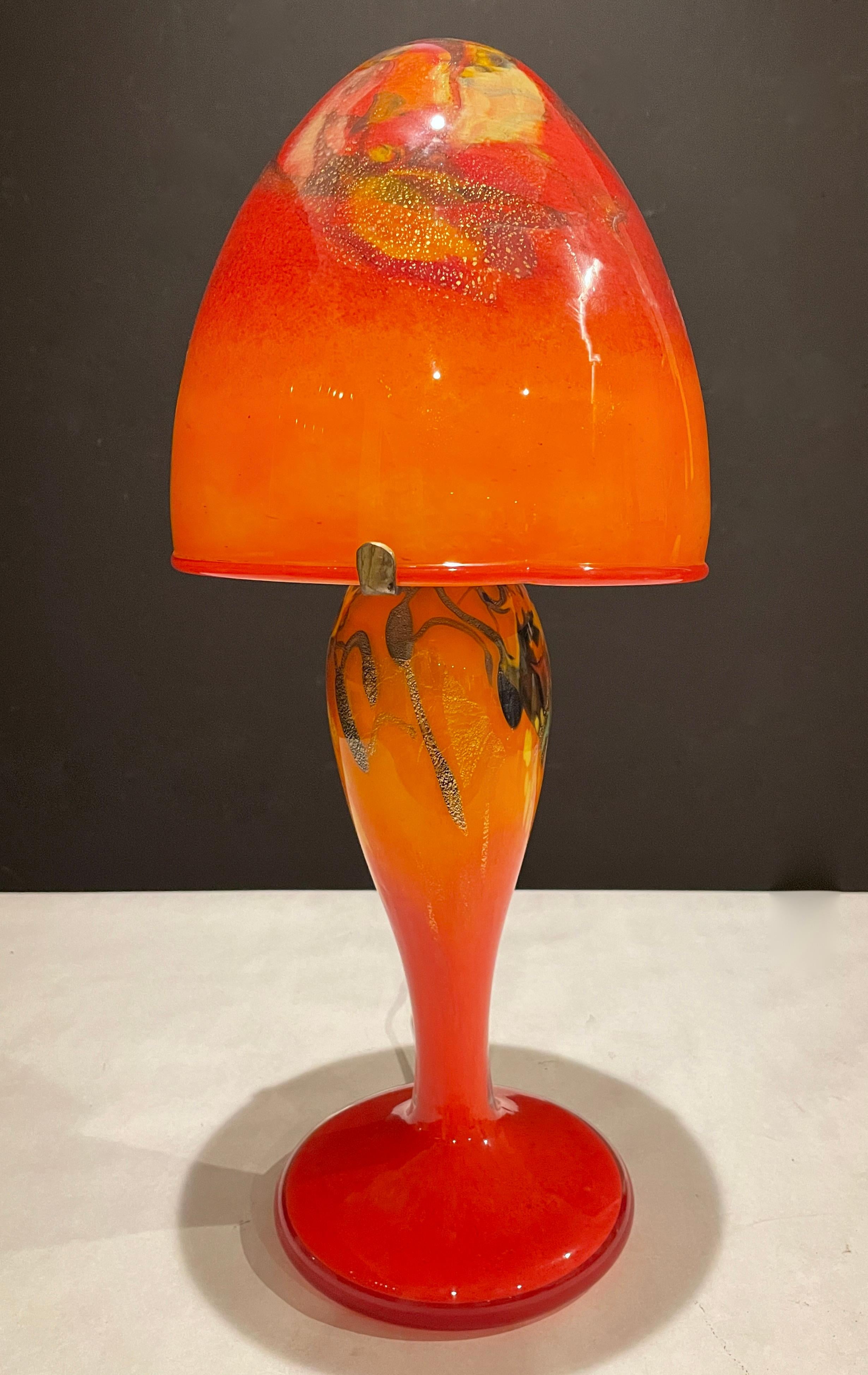 Modern hand blown art glass mushroom from art glass lamp by French glass designer and glass blower Pascal Guyot. Warm reds and oranges along with golden yellow and some darker tones. Signed and dated on base and shade.
