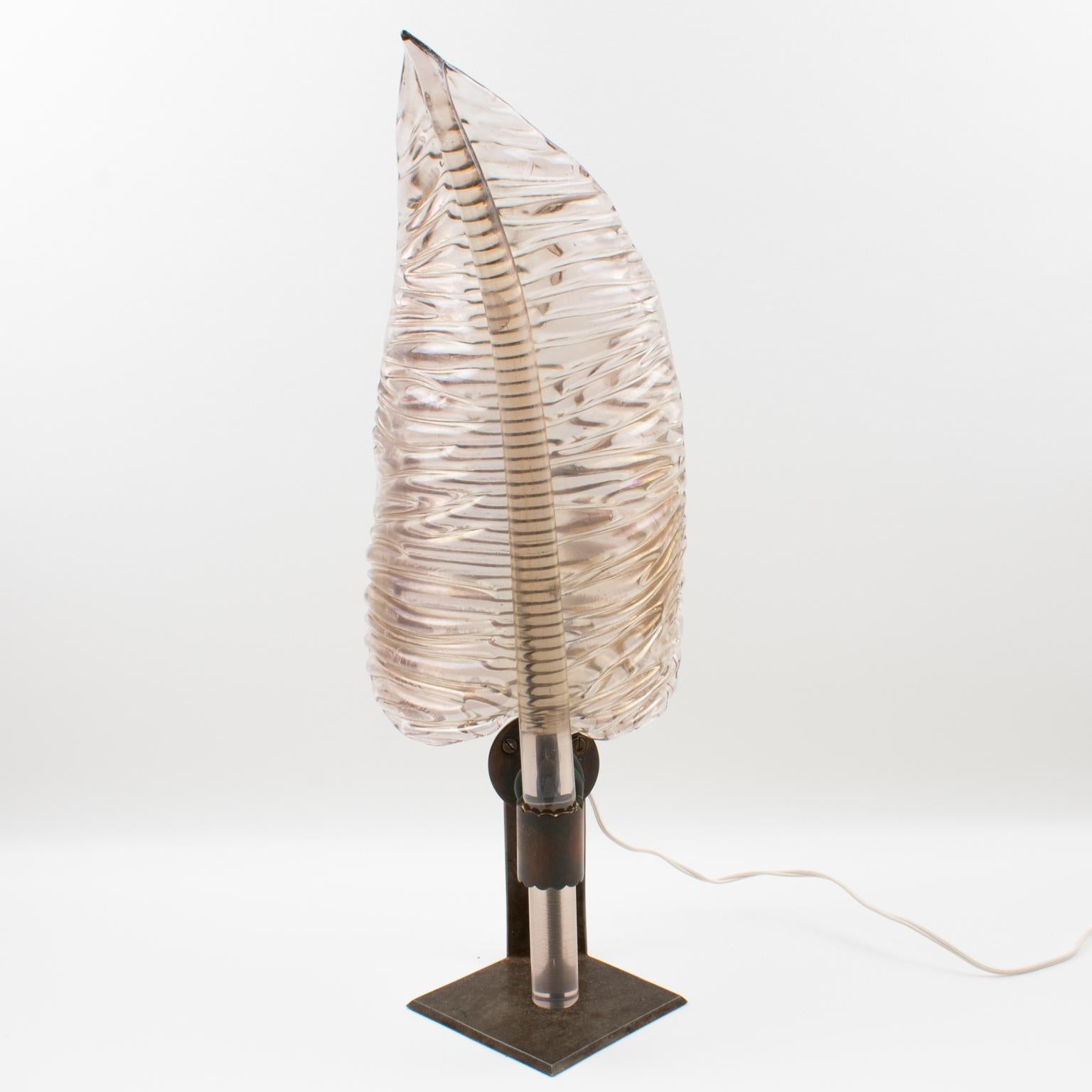 This beautiful blown Italian Art glass Murano table lamp or sconce boasts a sculptural palm-shaped shade in a transparent smoked gray color with iridescent purple and orange overtones. The original Verdigris patina holder was once a sconce. The