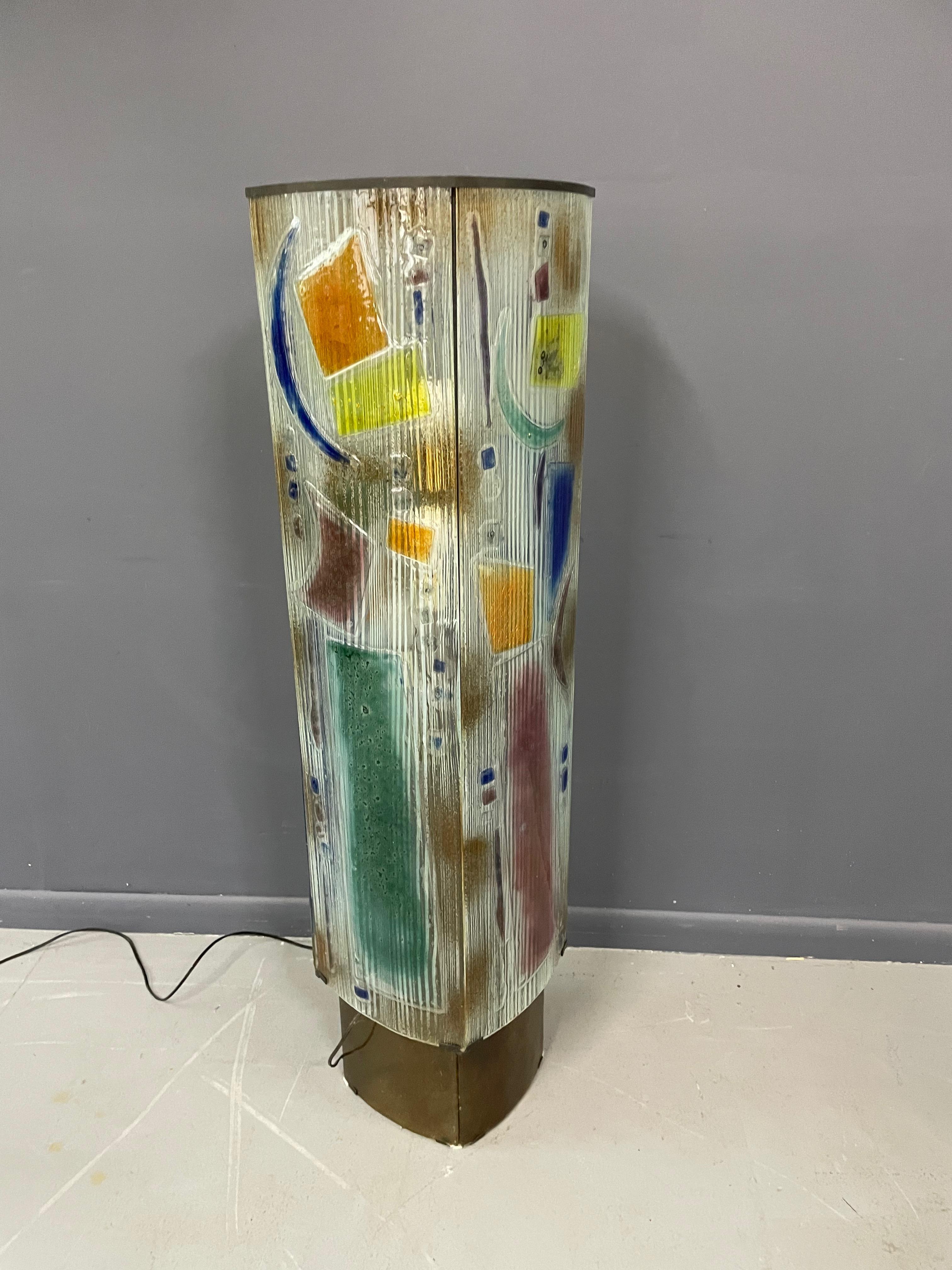 Wonderful floor lamp with four separate hand produced colorful panels with complimentary designs.