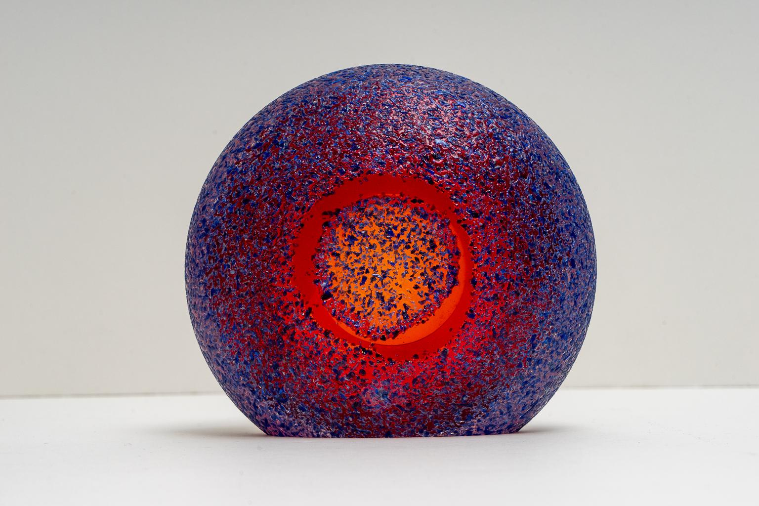 This stylish American art glass sculpture was acquired from a Palm Beach estate. The piece catches the light beautifully with an almost fire-like intensity.