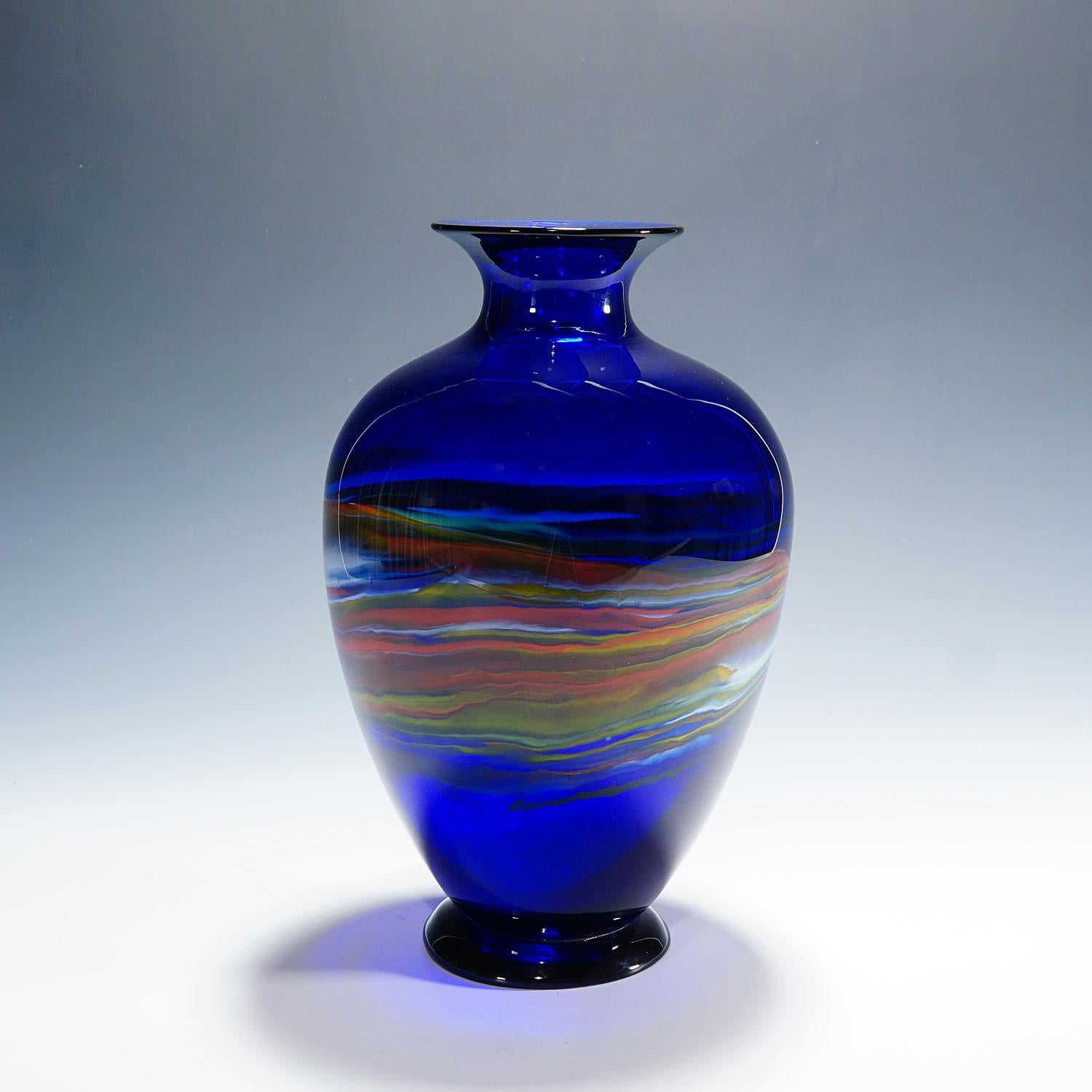 Art Glass Vase by Gianni Versage for Vetreria Archimede Seguso ca. 1990s

A large and heavy vintage art glass vase designed by Gianni Versage and manufactured by Vetreria Archimede Seguso in the 1990s. Dark blue glass with with a circumferential