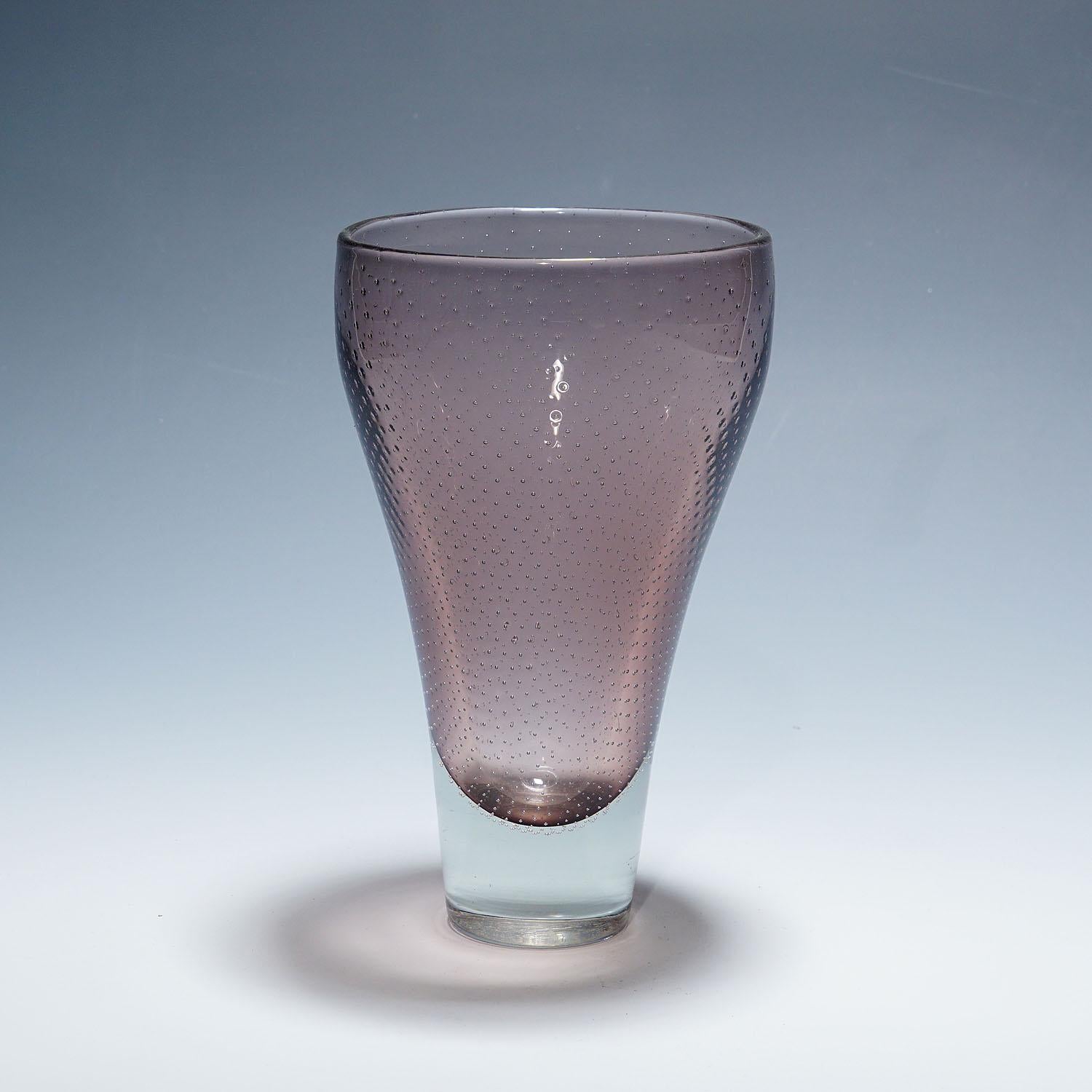 Art Glass Vase by Gunnel Nyman for Nuutajarvi Notsio

A Finnish art glass vase designed by Gunnel Nyman in the late 1940s and manufactured by Nuutajarvi Notsjo in the 1950s. Clear and lilac glass decorated with regular air bubbles. Signed with