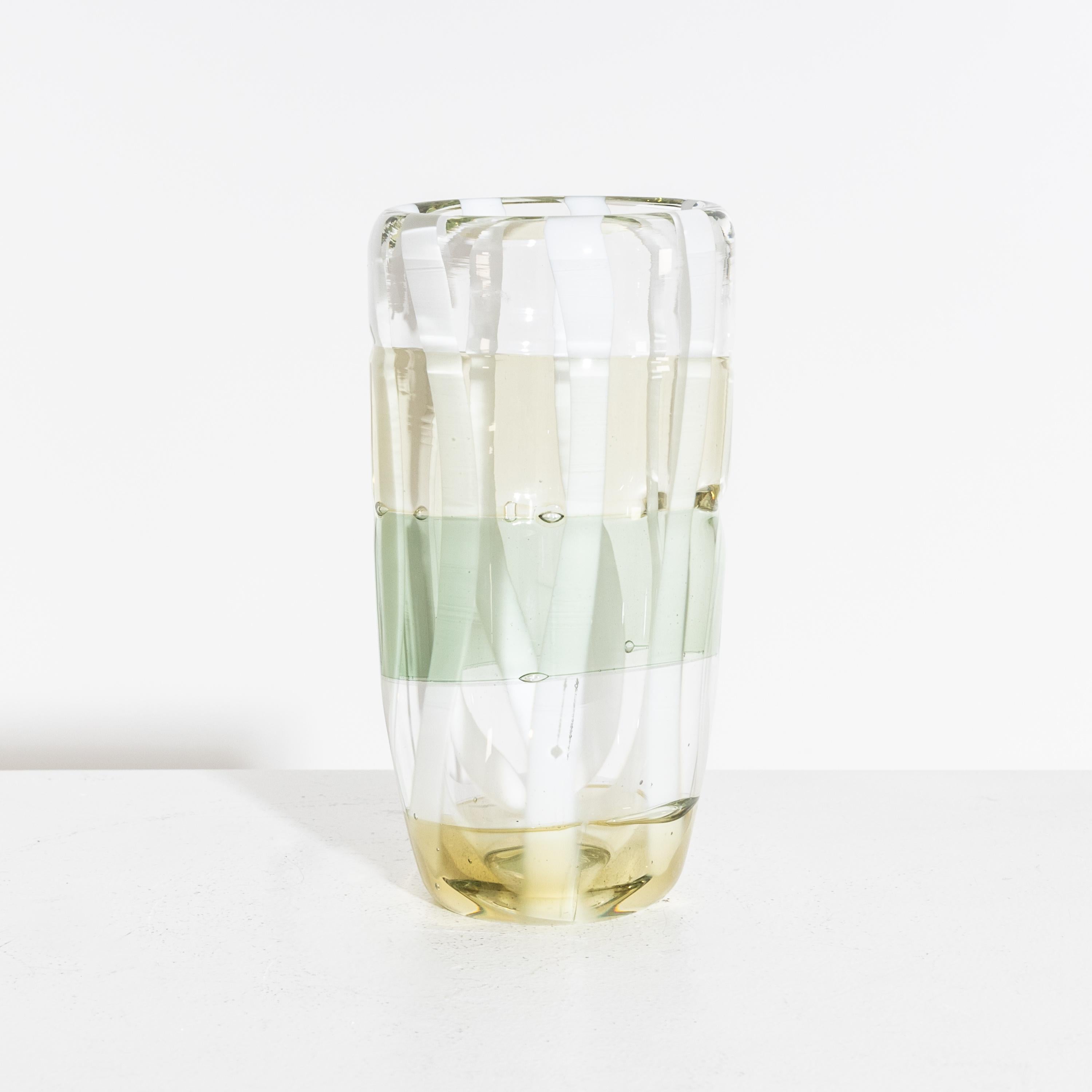 A small art glass vase by Martin Potsch.
Vase with clear, yellow, green and, white.
