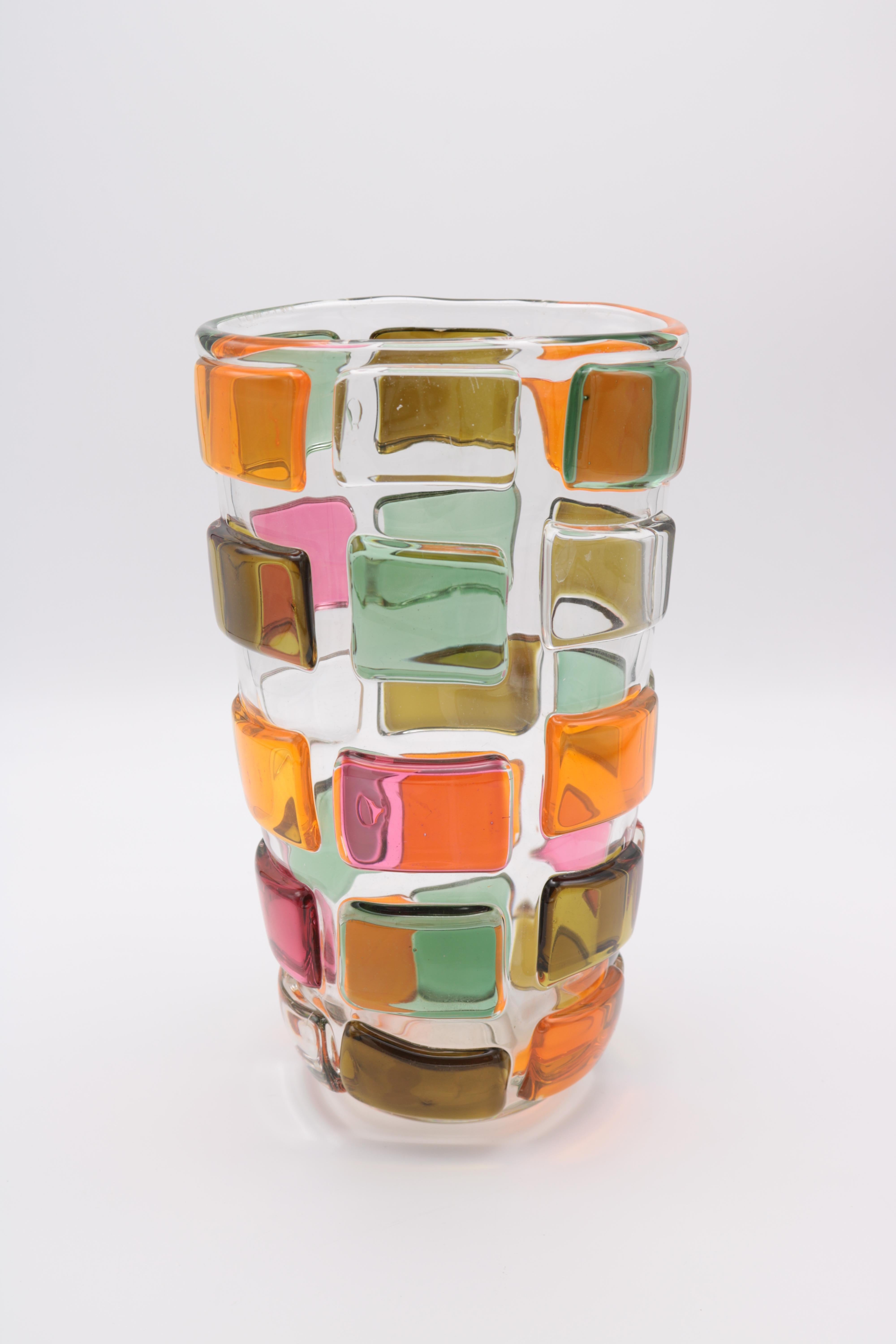 An art glass vase by Martin Potsch. 
Clear glass with muti-colored glass 
planels surrounding the main form.
 