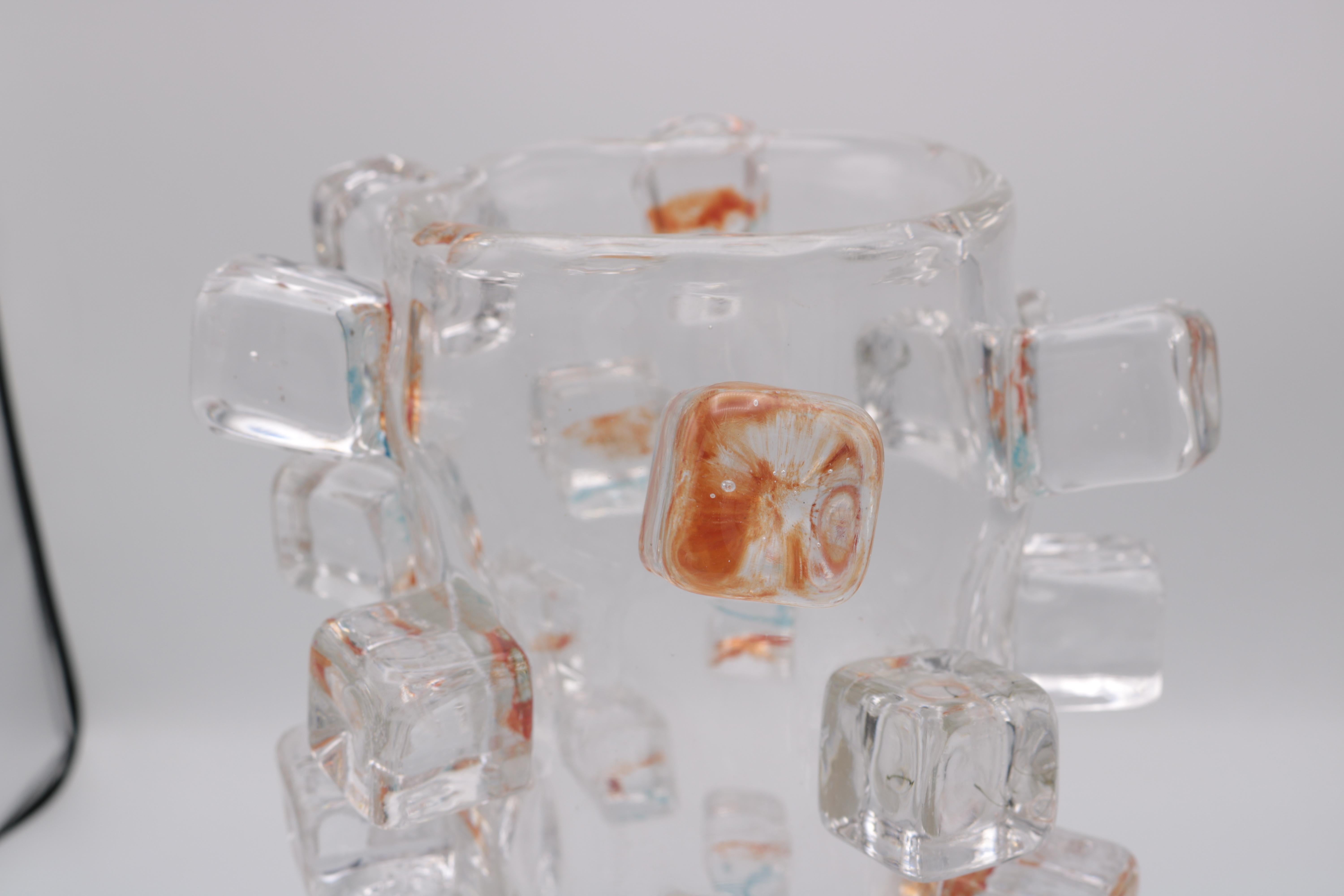 An art glass vase by Martin Potsch.
Clear Glass with semi colored glass cubes surrounding the vase.
Etched signature on the bottom.